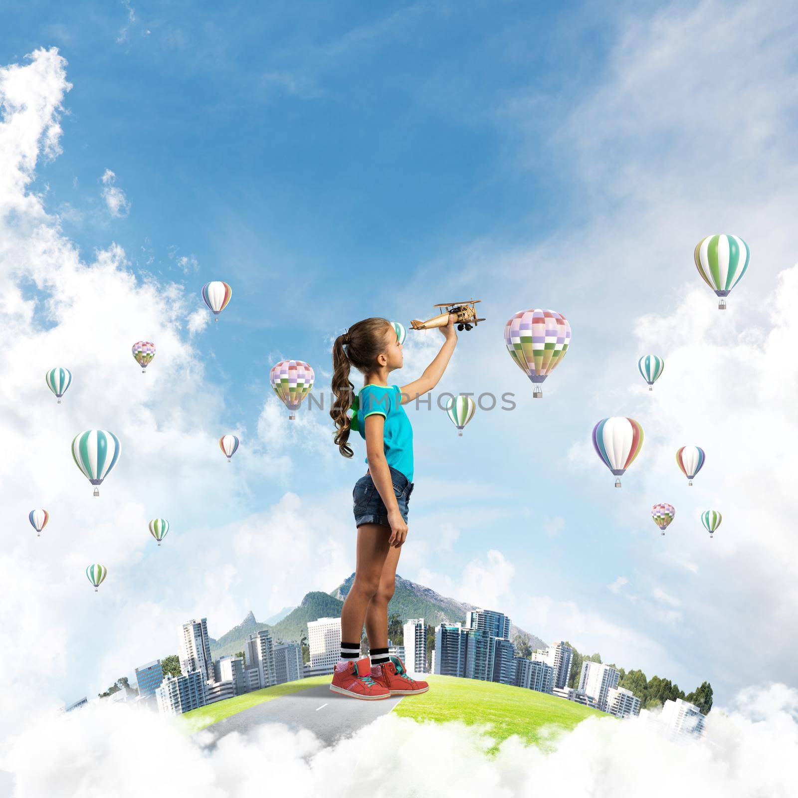 Cute kid girl on city floating island playing with retro plane model