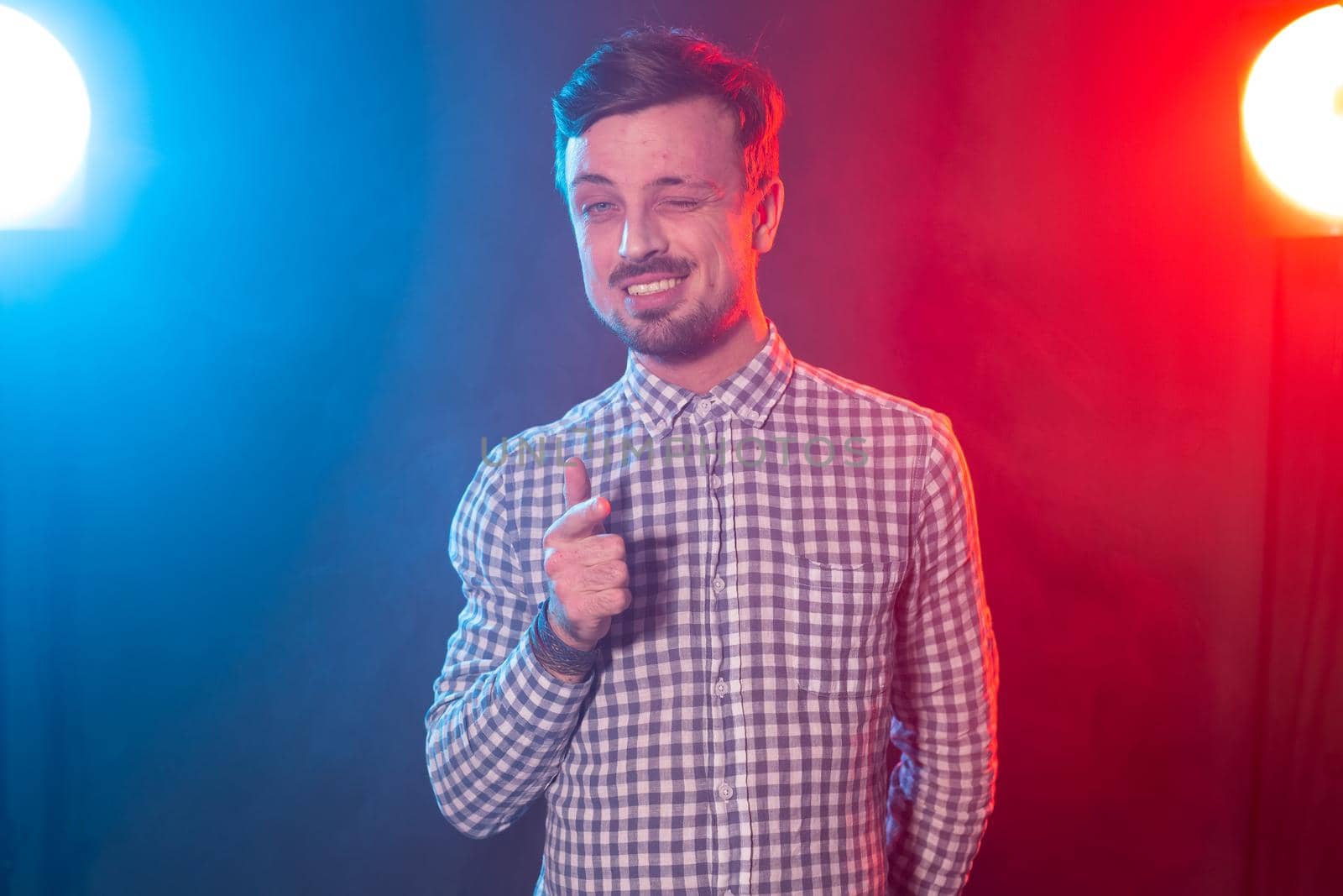 Young handsome bearded hipster man with a beard confidently shows into the camera bearing in mind you. Concept of choice and winnings in a competition or a lottery