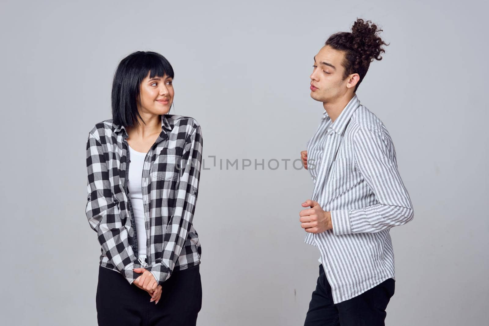 young couple modern clothes posing fun friendship. High quality photo