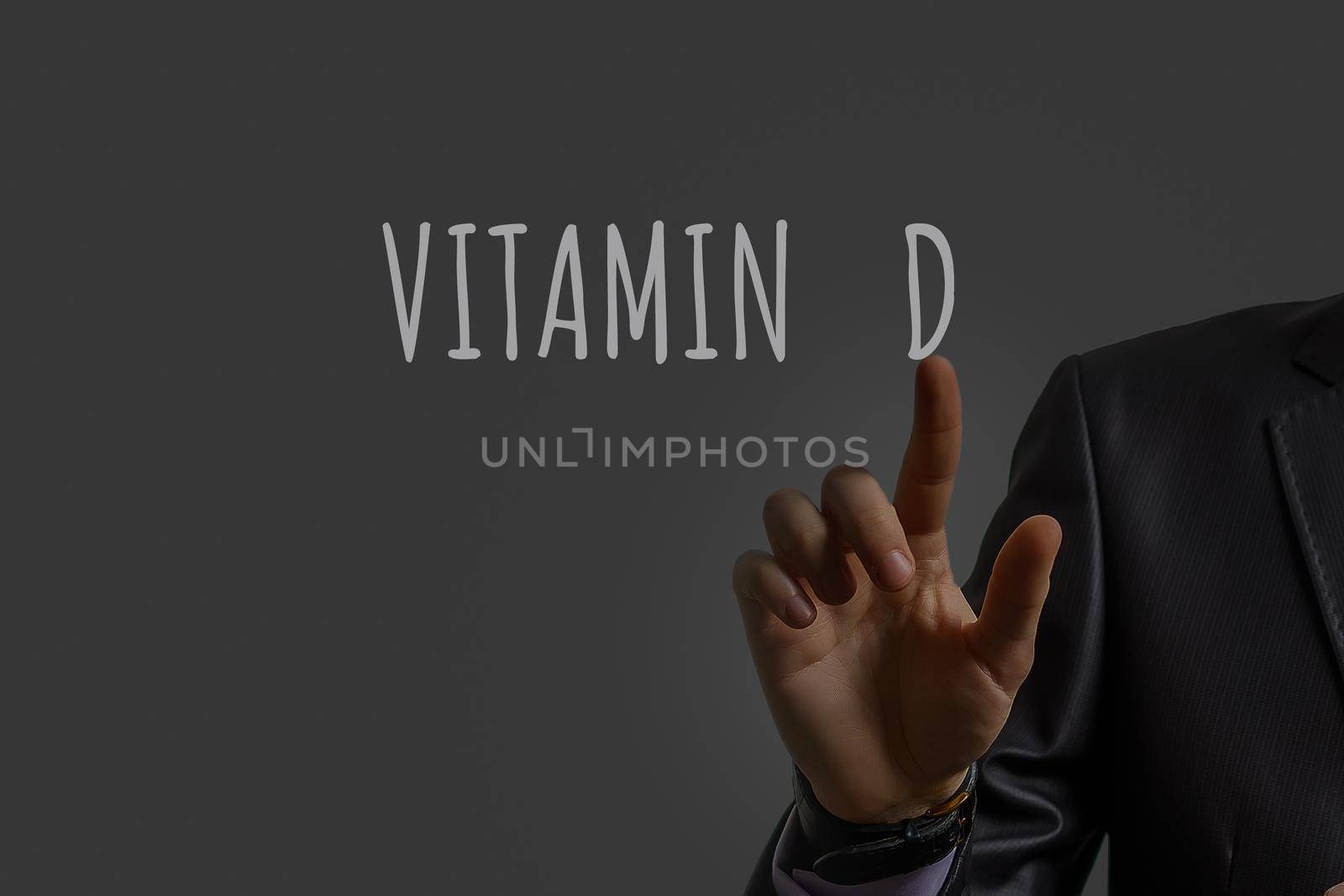 businessman's hand shows vitamin d