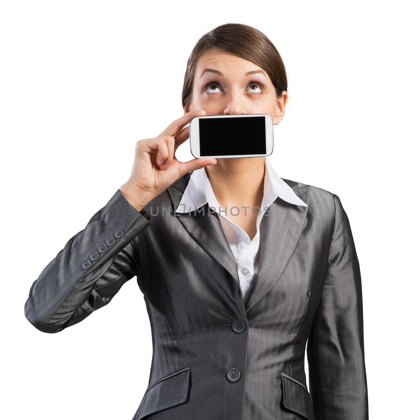 Portrait of young woman covering her mouth with smartphone. Businesswoman showing mobile phone with blank screen. Corporate businessperson isolated on white background. Mobile communication layout