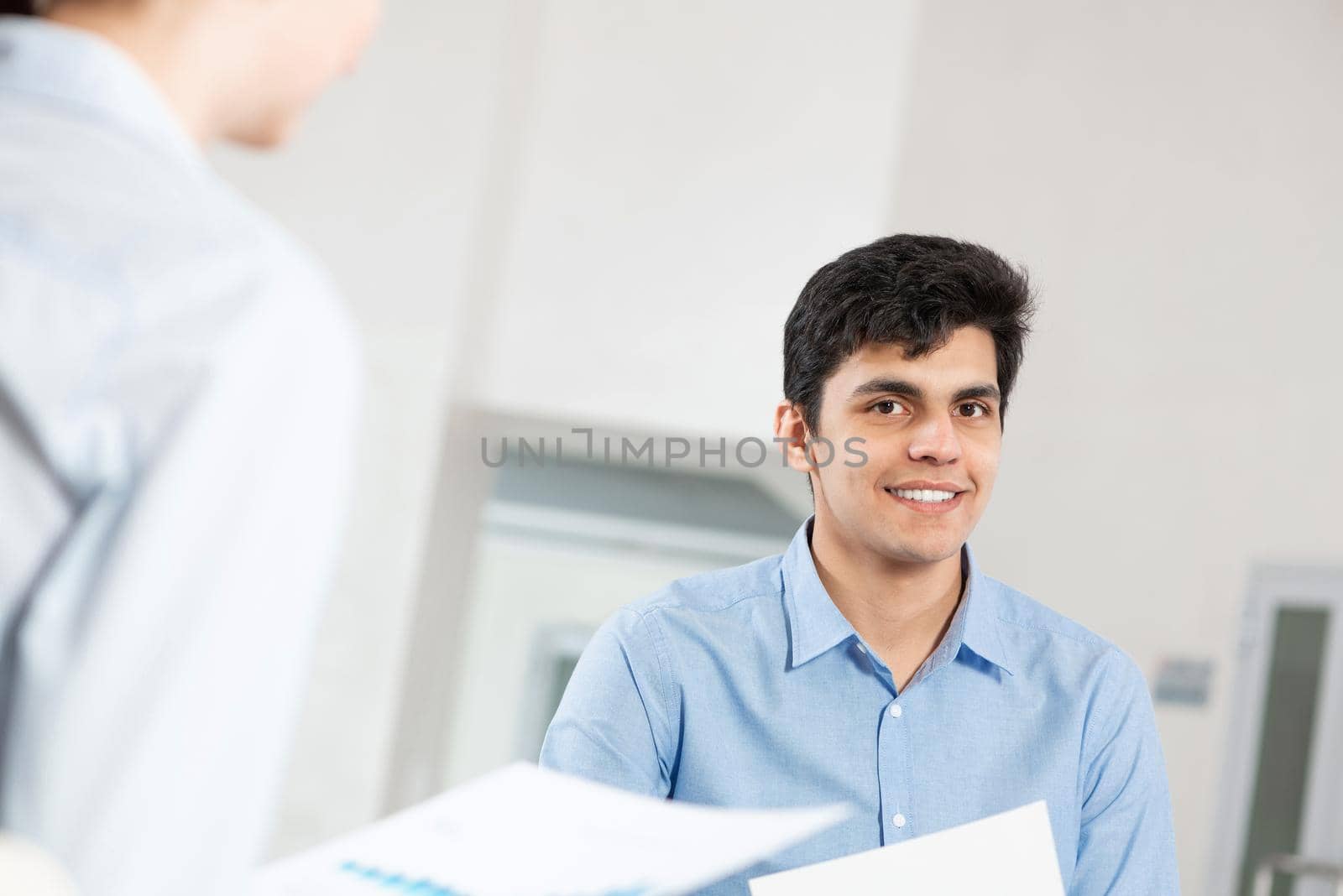 portrait of a young man at a business meeting by adam121