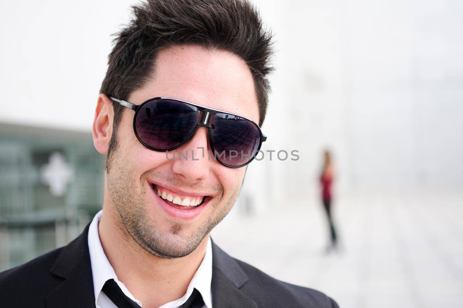 Portrait of a handsome young businessman laughing