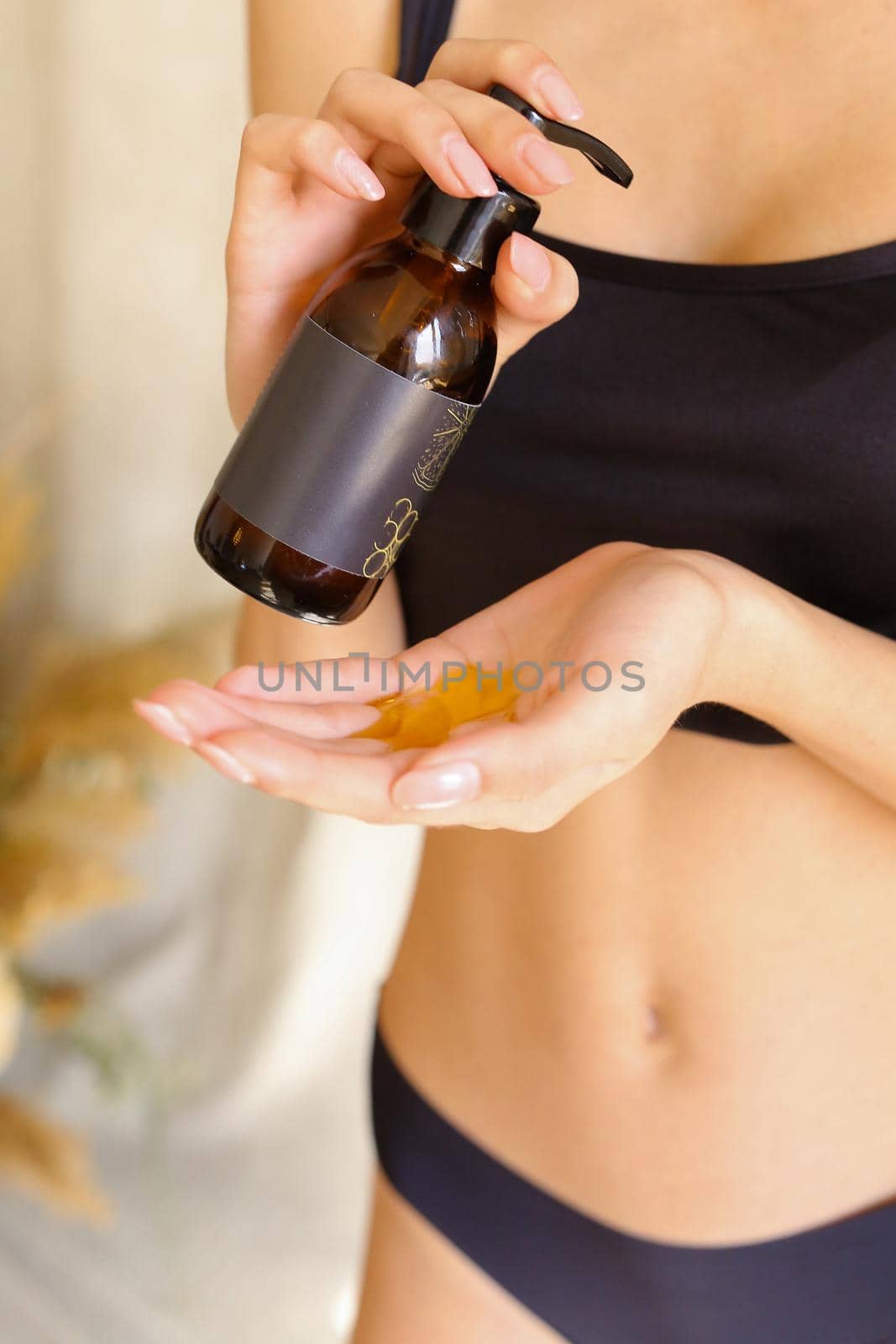 Closeup shot of beautiful female hands applying moisturiser. Beauty woman's hand applying cream by sisterspro