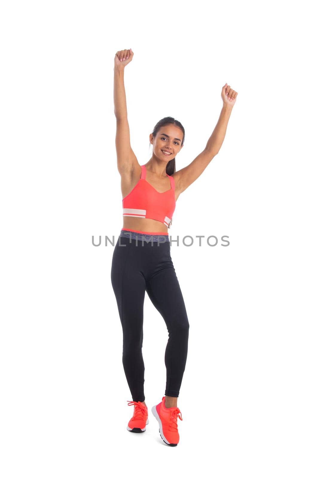 Fitness woman hold raised arms up by ALotOfPeople