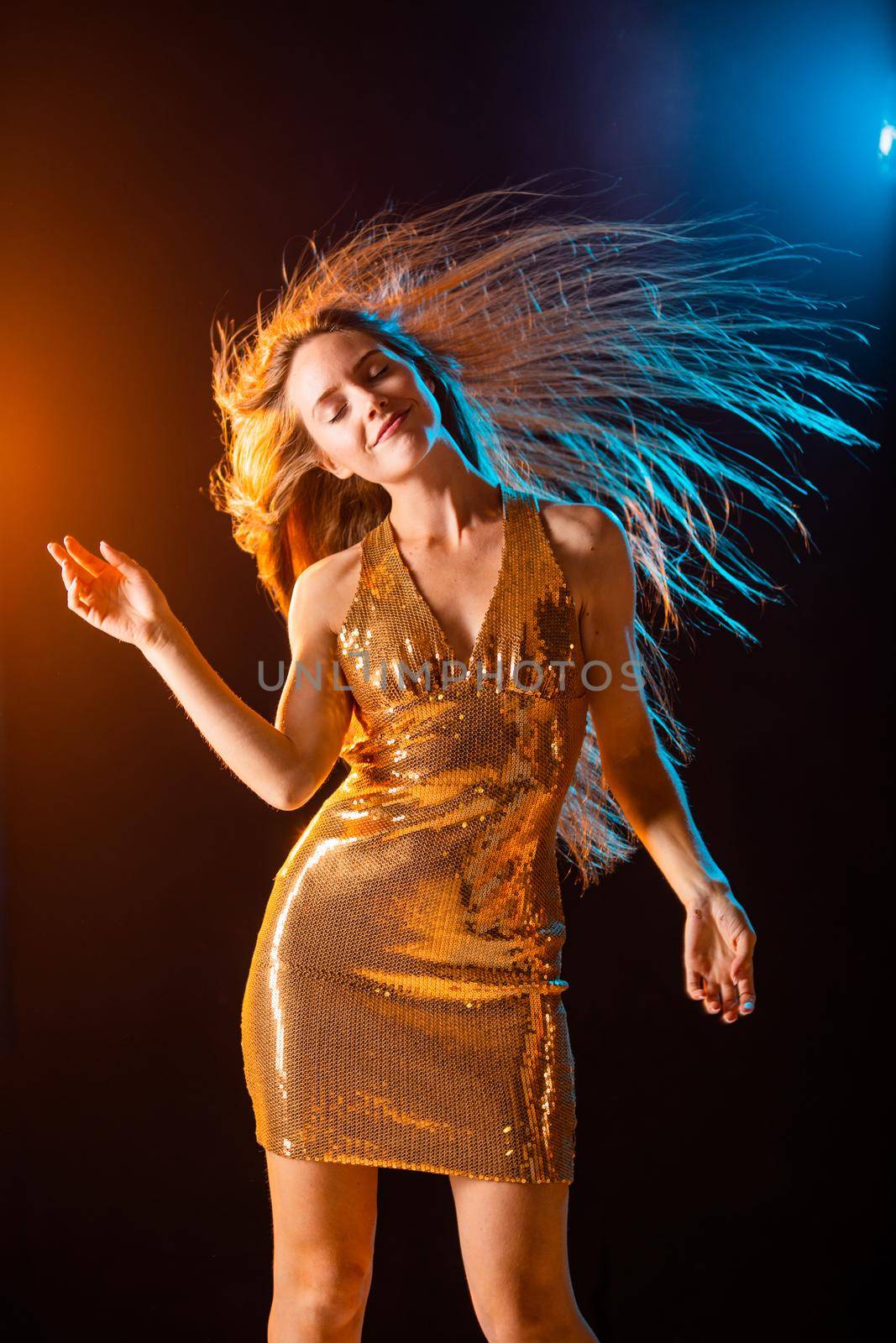 Girl in Golden dress dancing by ALotOfPeople