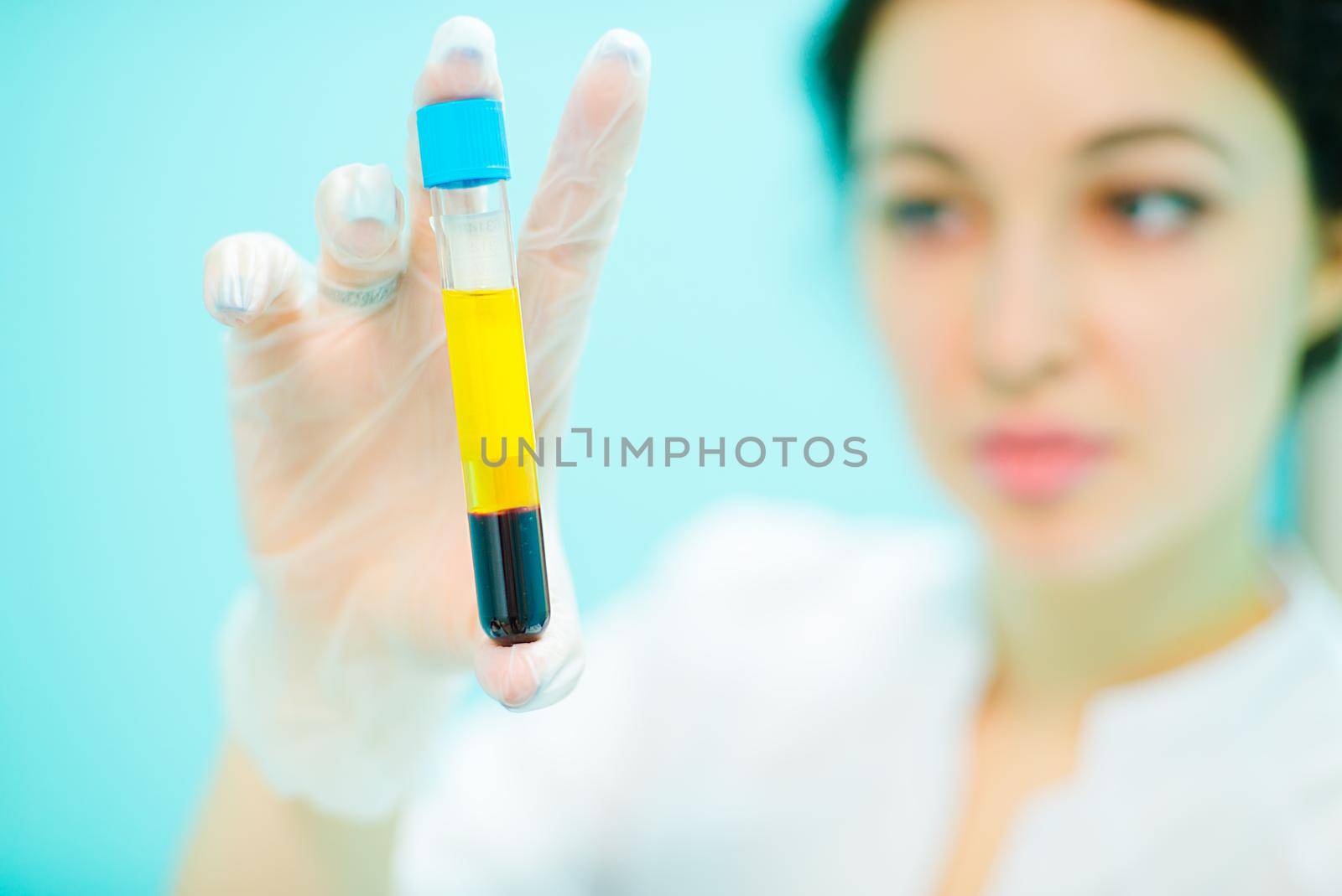 Doctor with a test tube of blood and plasma