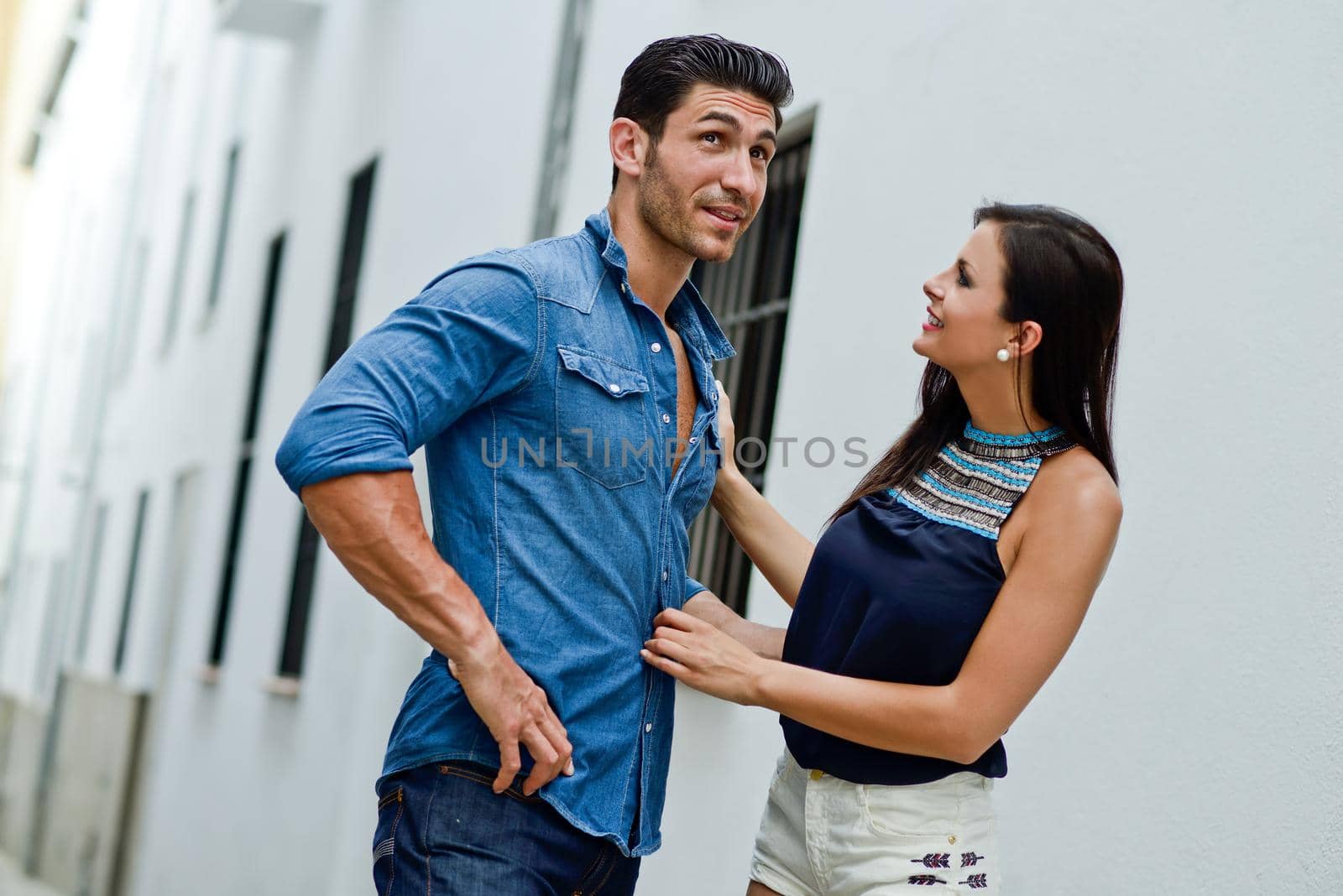 Happy smiling couple in urban background