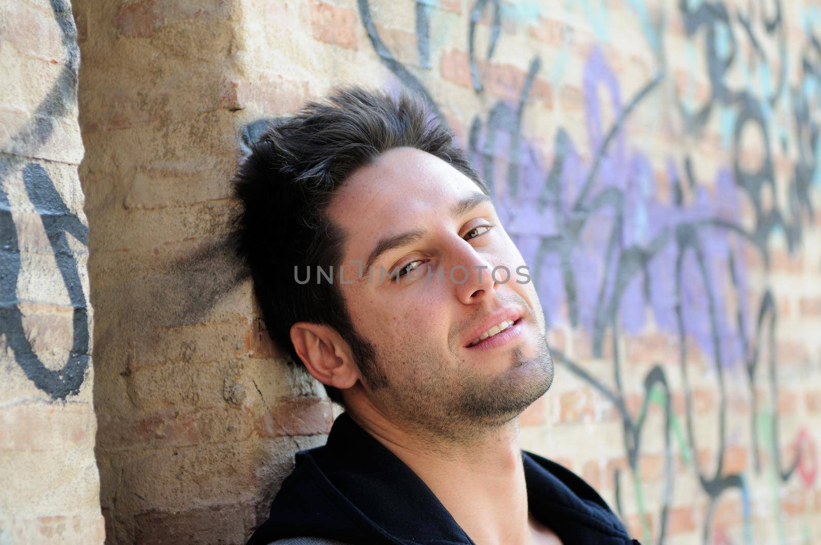 Portrait of happy man in urban background