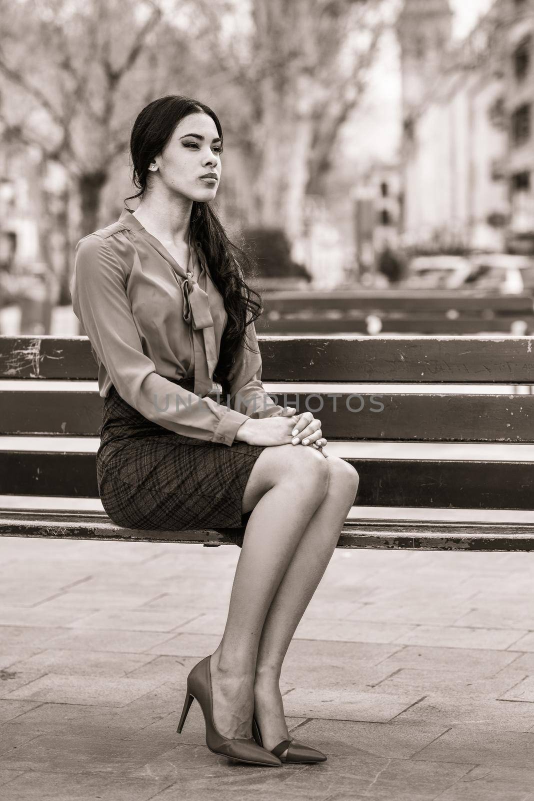 Hispanic stewardess in urban background by javiindy