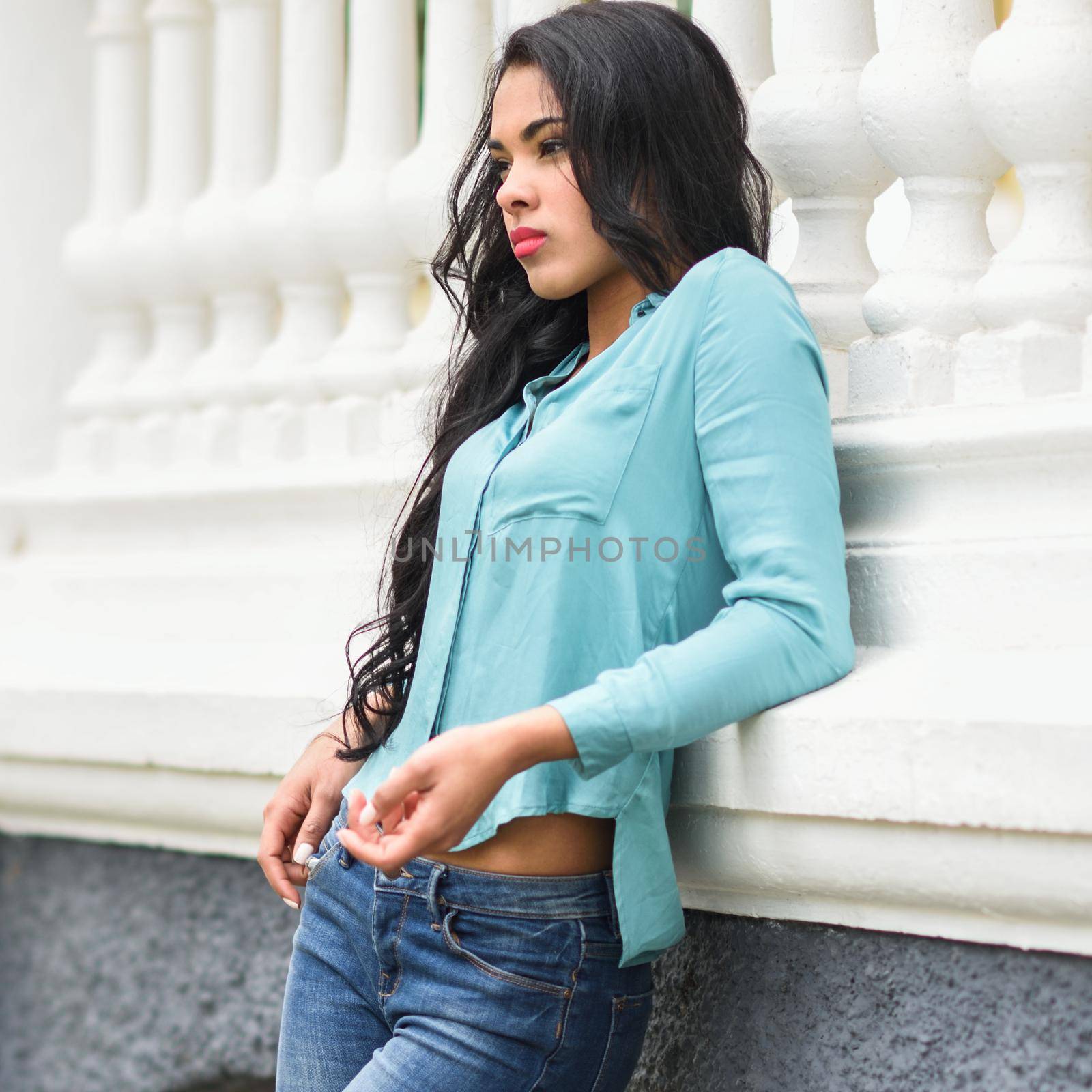 Hispanic young woman wearing casual clothes in urban background by javiindy