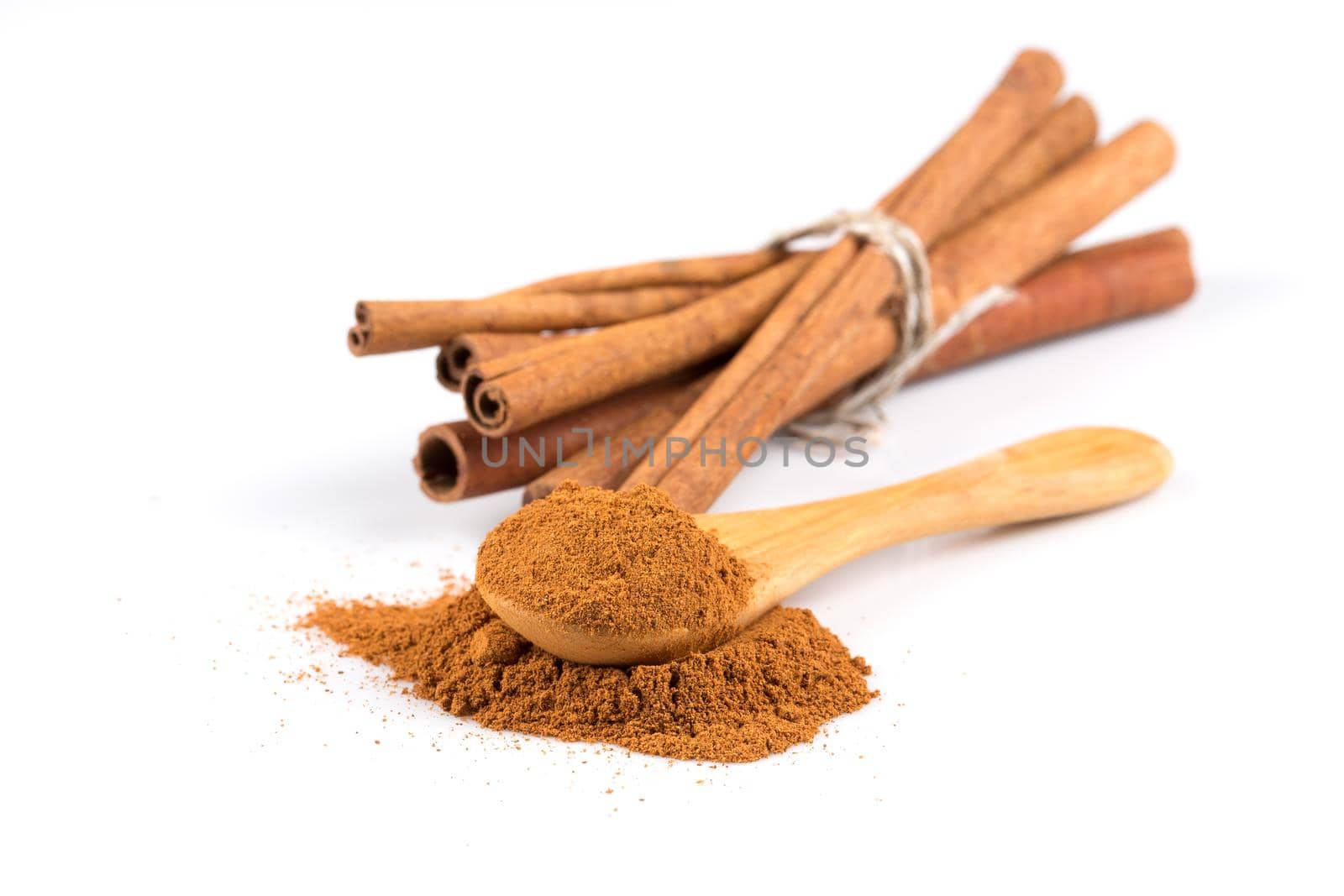 cinnamon ground and sticks isolated on a white background