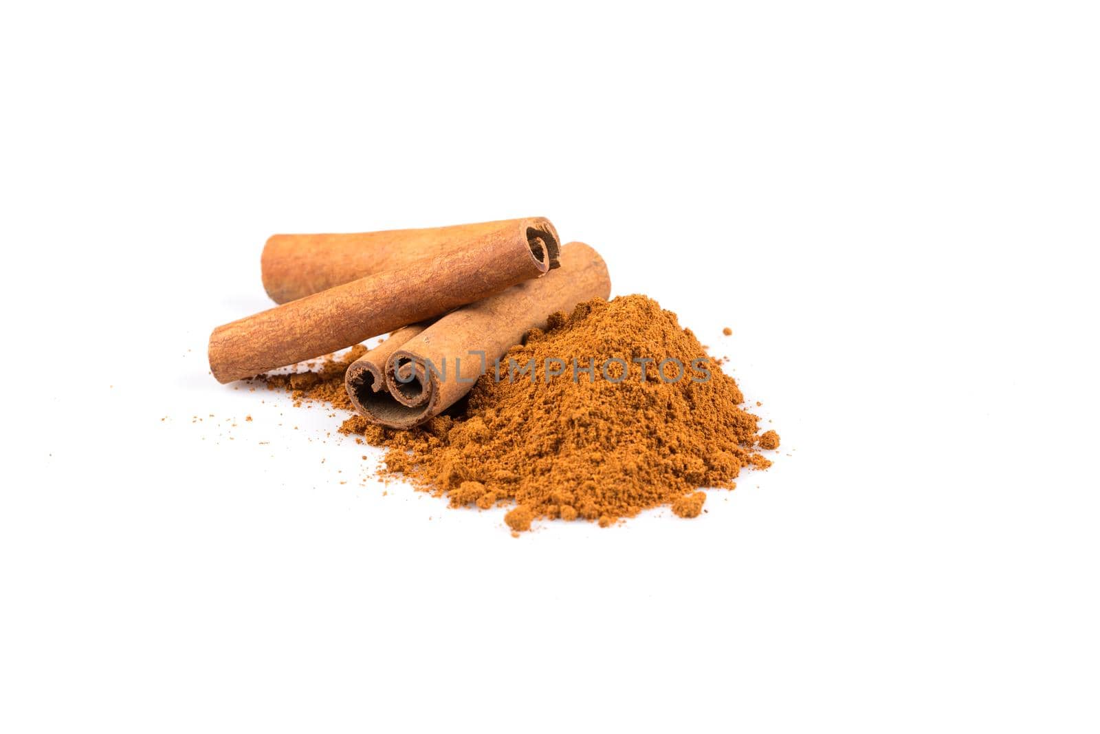 cinnamon sticks with powder isolated on white background