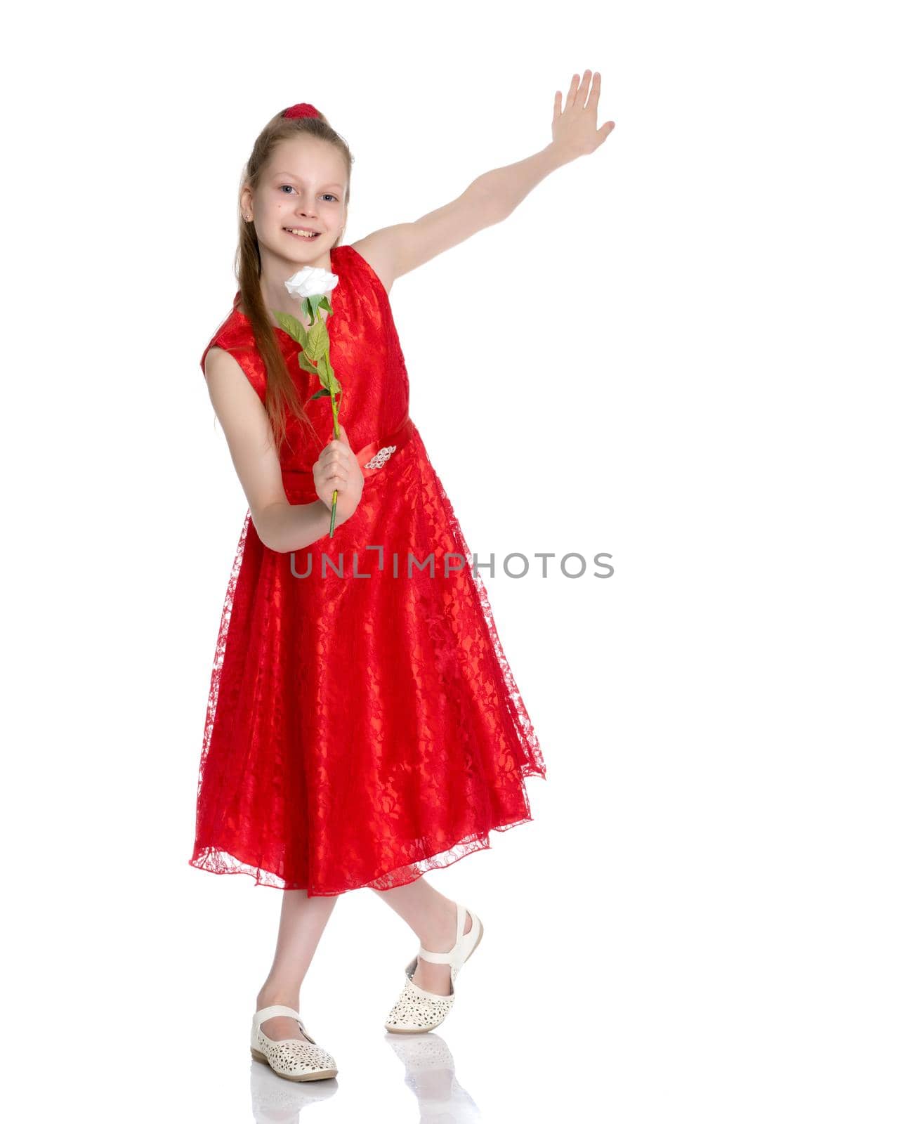 Beautiful little girl with a flower in her hands. The concept of beauty and fashion, happy childhood. Isolated on white background.