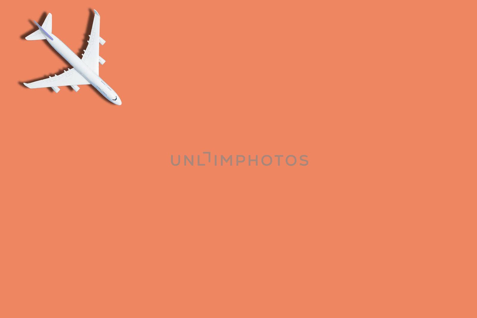 airplane figure on pink background