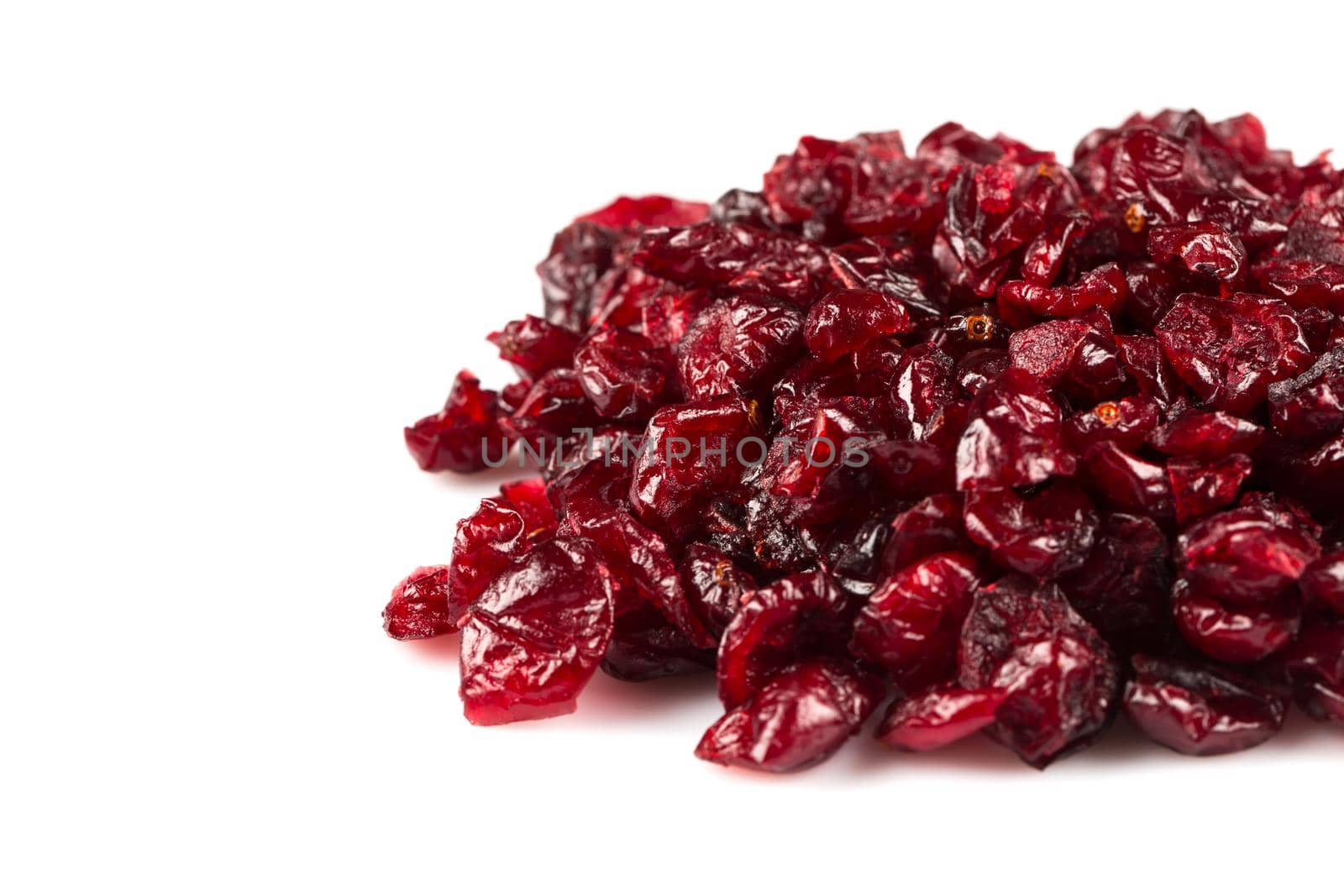 Pieces of dried cranberries isolated on white background