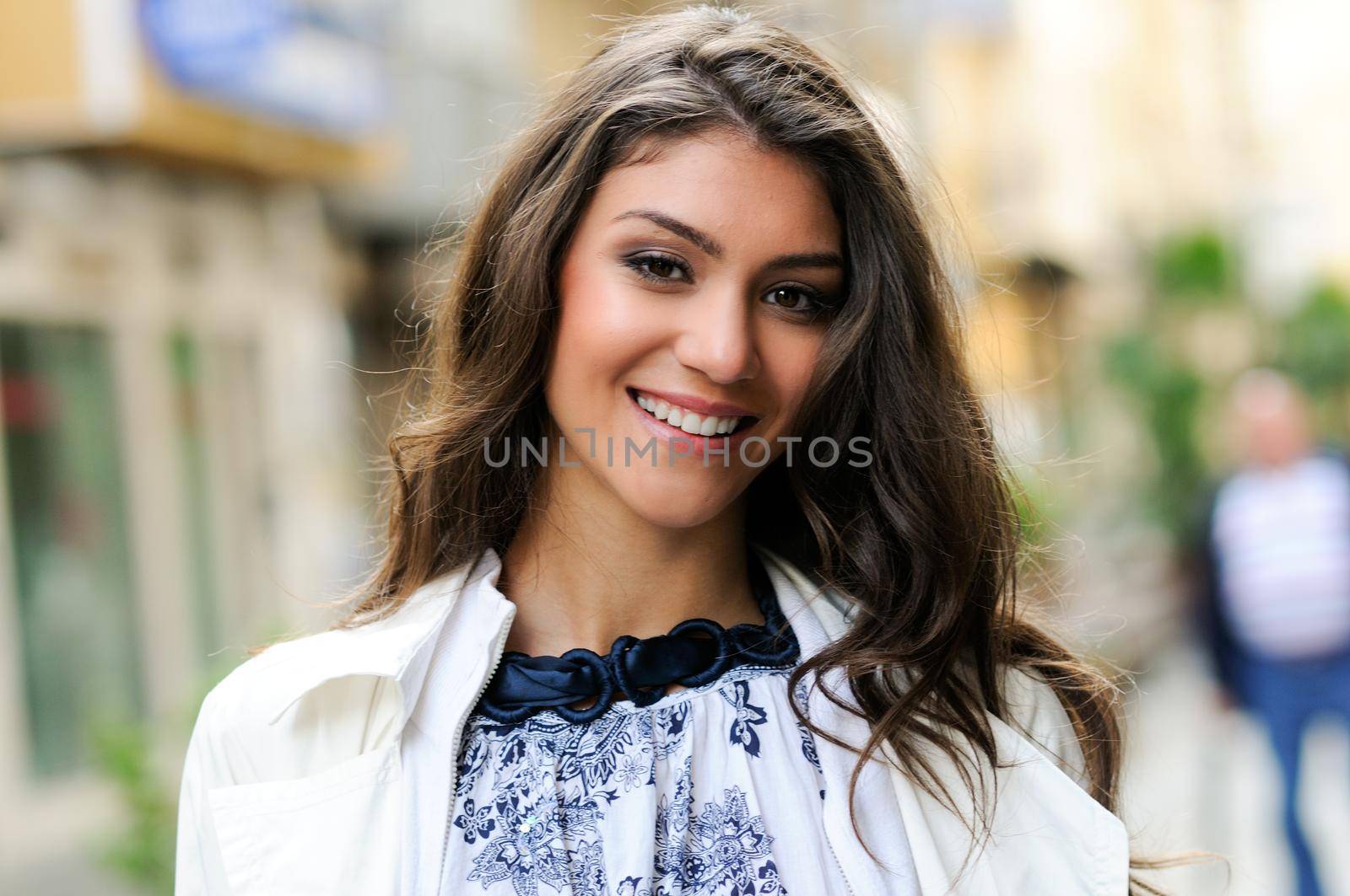 Portrait of a beautiful woman smiling in urban background
