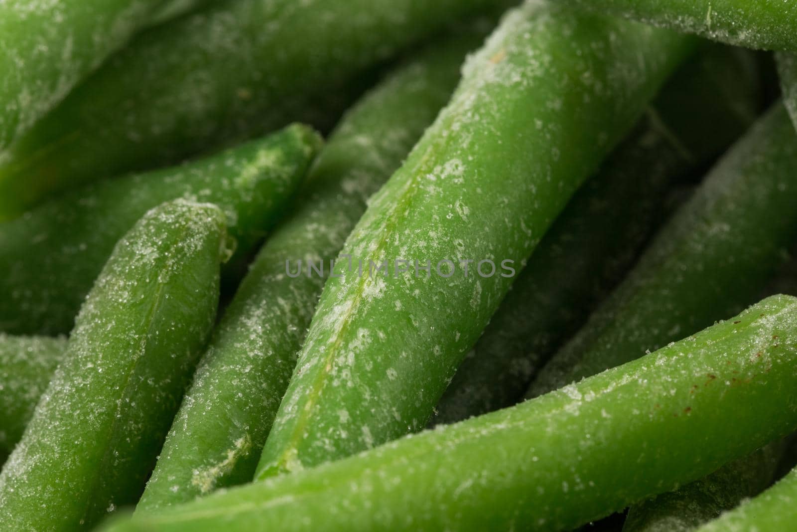 Frozen cut green beans vegetable, closeup for background