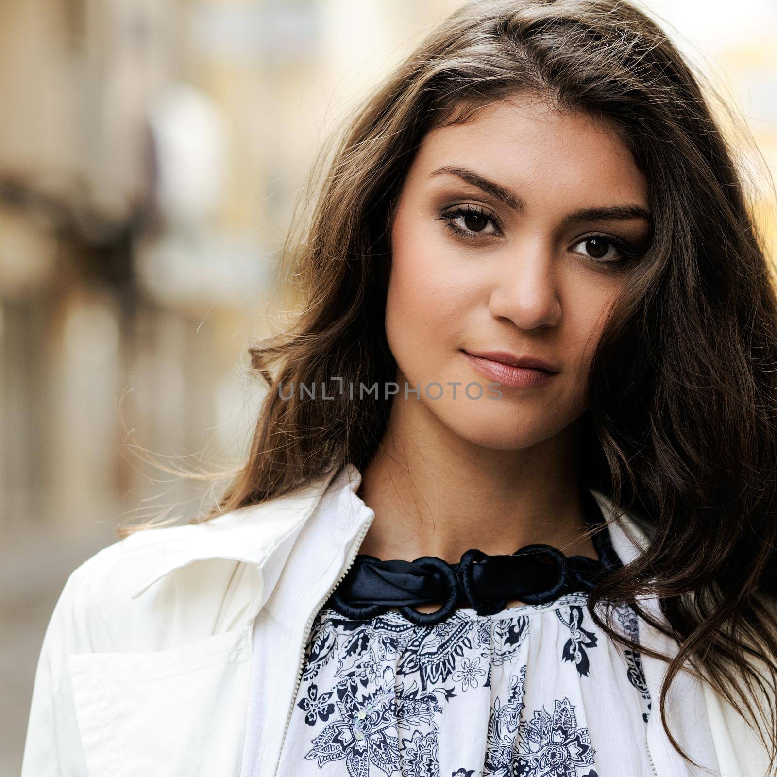 Portrait of a beautiful woman smiling in urban background