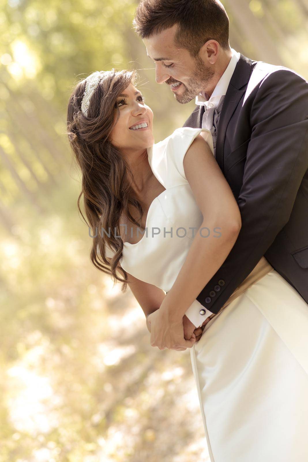 Just married couple together in poplar background