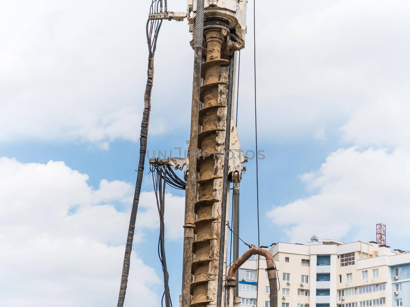 Construction site with concrete and steel and crane lifting equipment