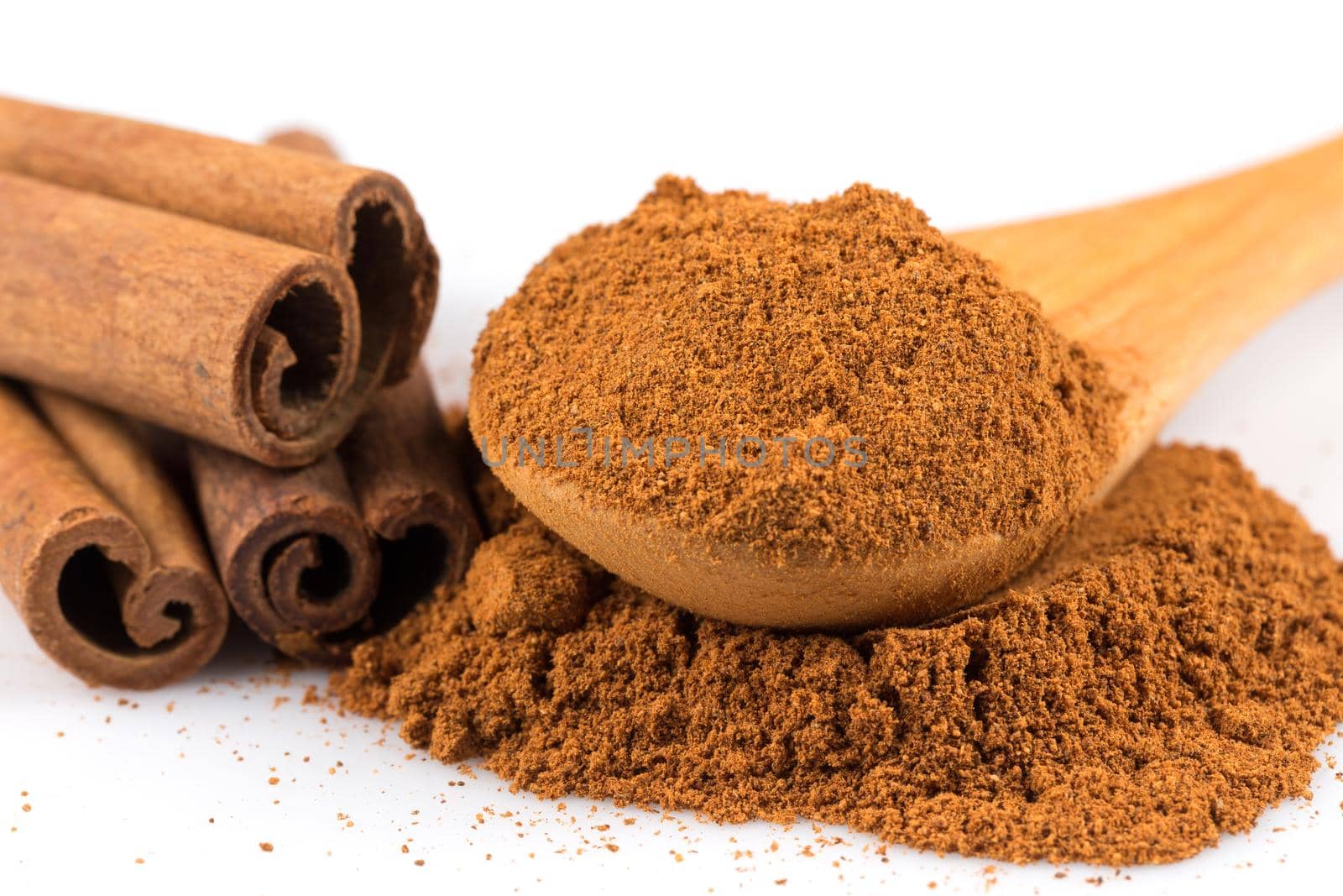 cinnamon ground and sticks isolated on a white background
