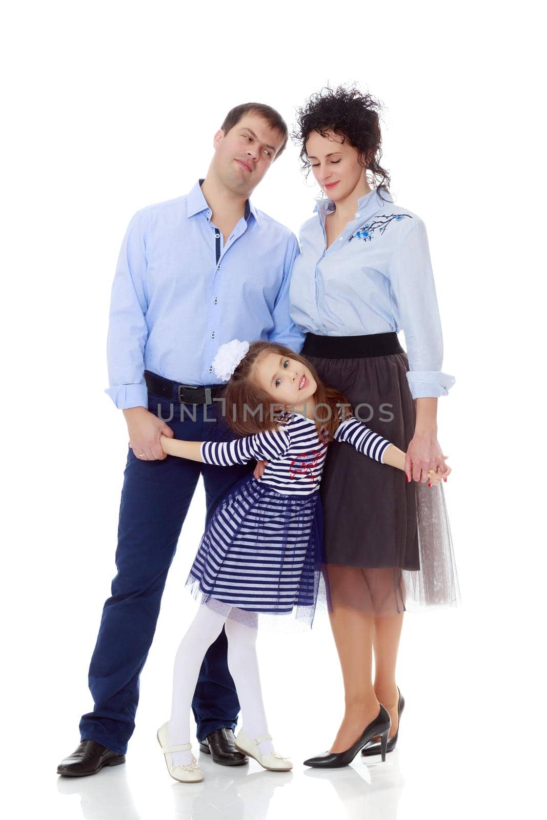 Happy young family, mom dad and little daughter.The parents keep the girl's hands.Isolated on white background.