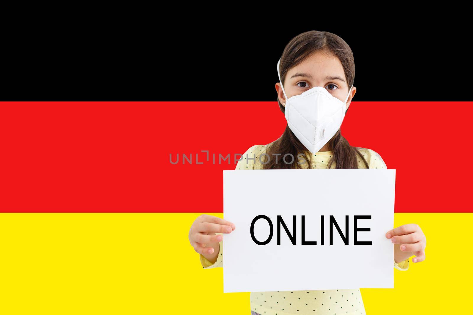 Masked little girl face looking at the camera on flag Germany background. The concept of attention to the worldwide spread of the coronavirus worldwide. Coronavirus, virus in Germany.