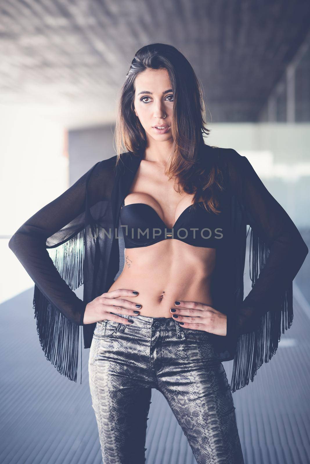 Portrait of young beautiful woman, model of fashion, wearing transparent shirt and black bra