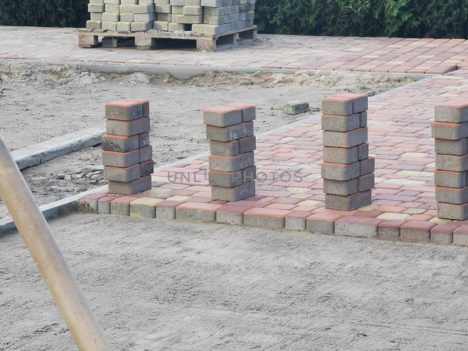 laying paving slabs on city square, repairing sidewalk