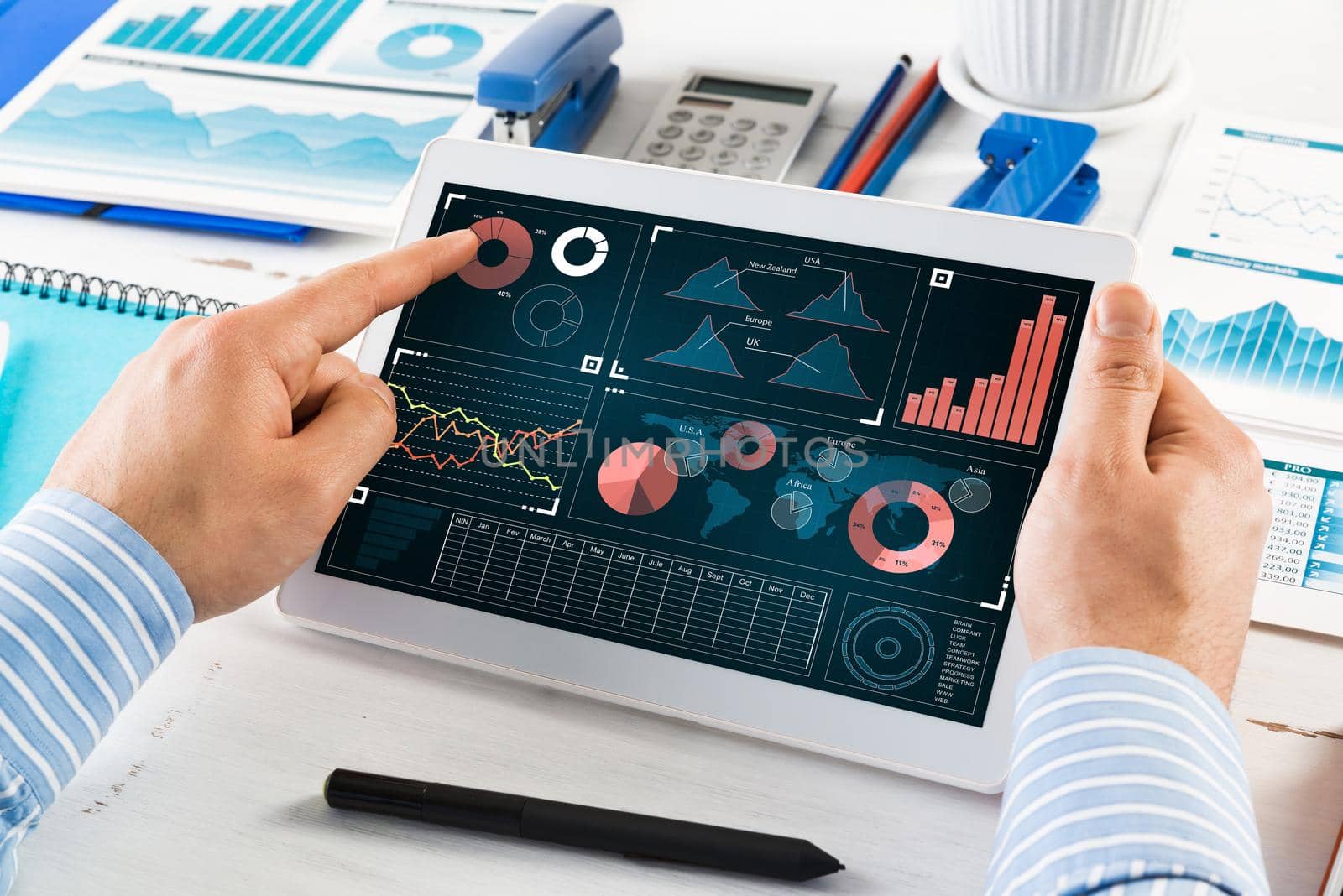 close-up, male hands with tablet. Businessman working at the table in office
