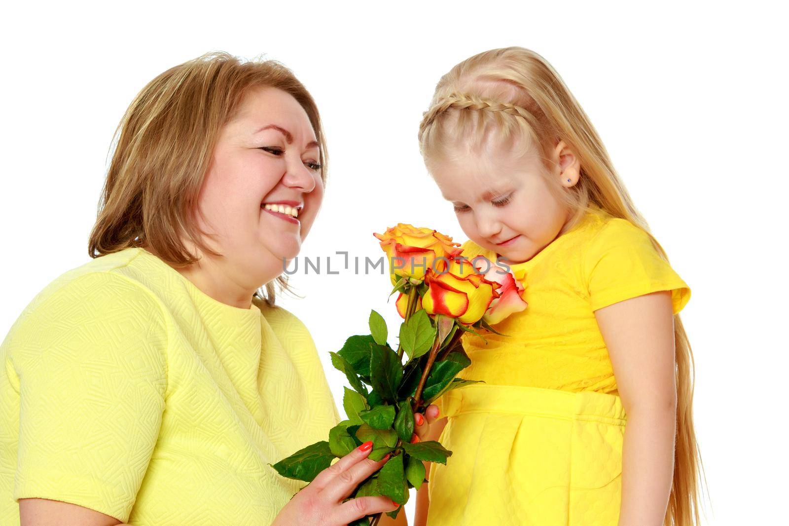 Mom and little daughter plus the size of the model, with a bouqu by kolesnikov_studio