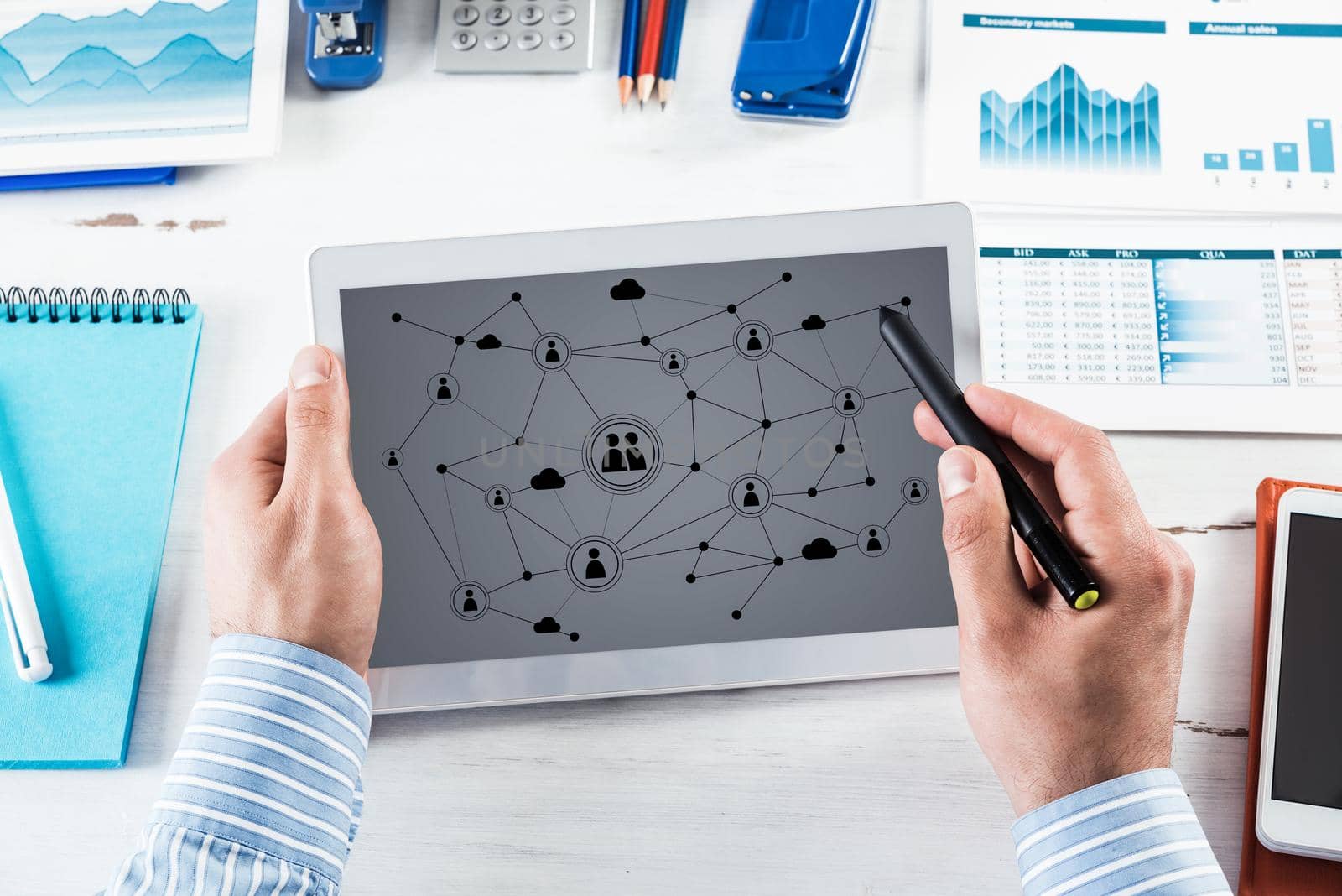 Men's hands hold a computer tablet. Social media concept