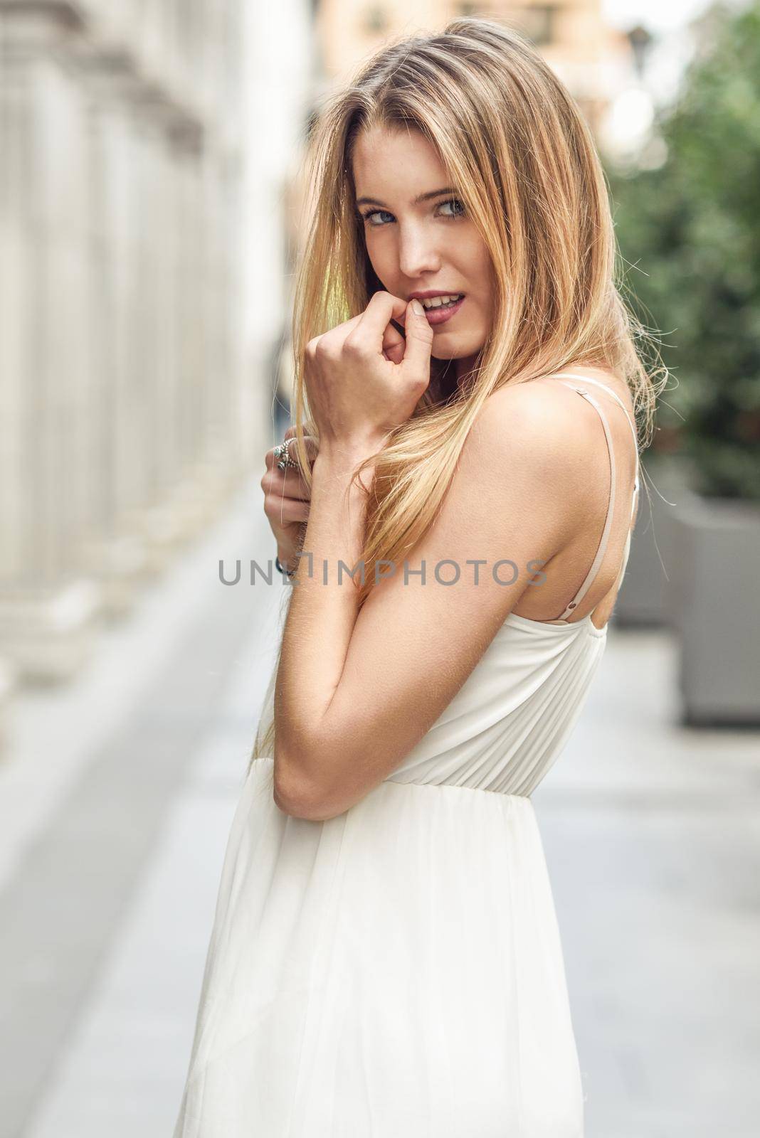 Beautiful blonde girl in urban background by javiindy