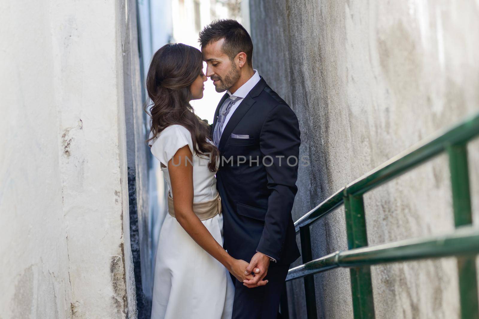 Just married couple in urban background by javiindy