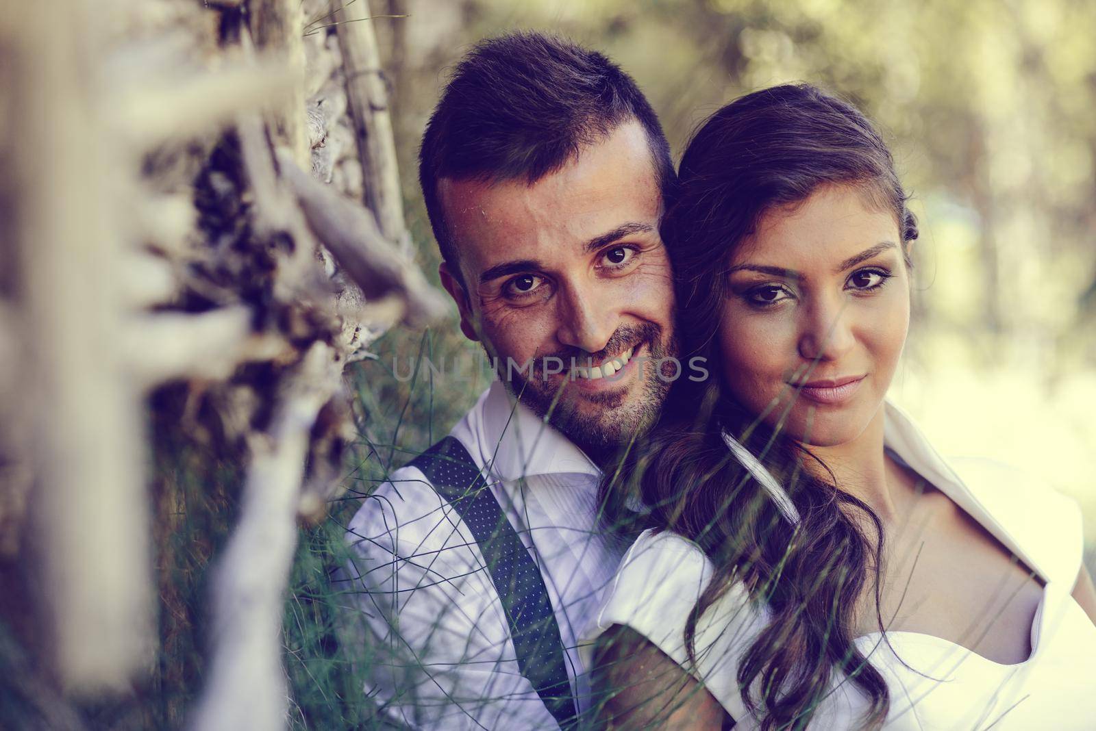 Just married couple in nature background by javiindy