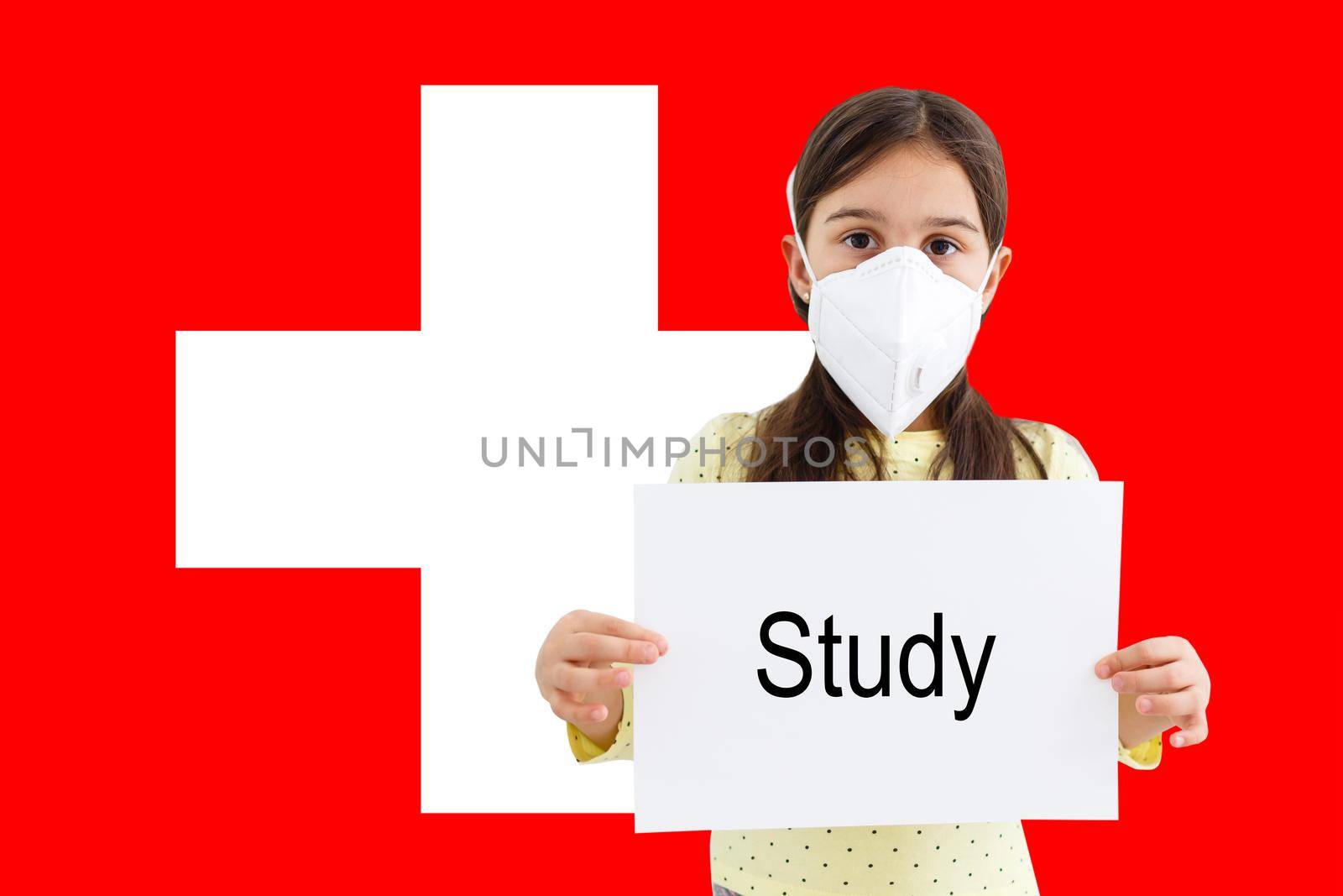 little girl in mask looks at the camera on the background of the Switzerland flag. Health care and medical concept. Surgery concept and fight the virus in Switzerland.