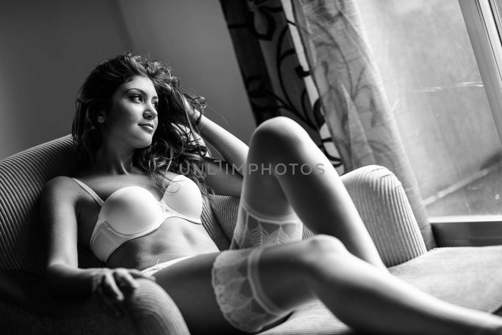 Sexy young woman wearing bride lingerie. White bra and panties