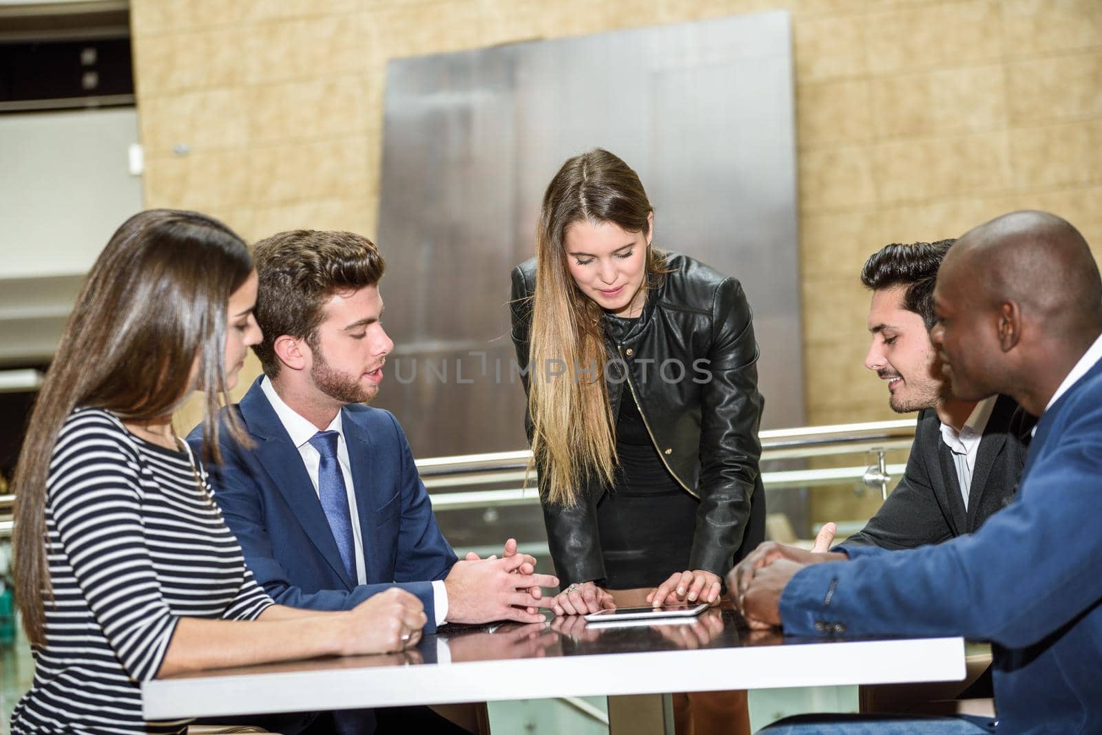 Businesspeople, teamwork. Group of multiethnic busy people working in an office