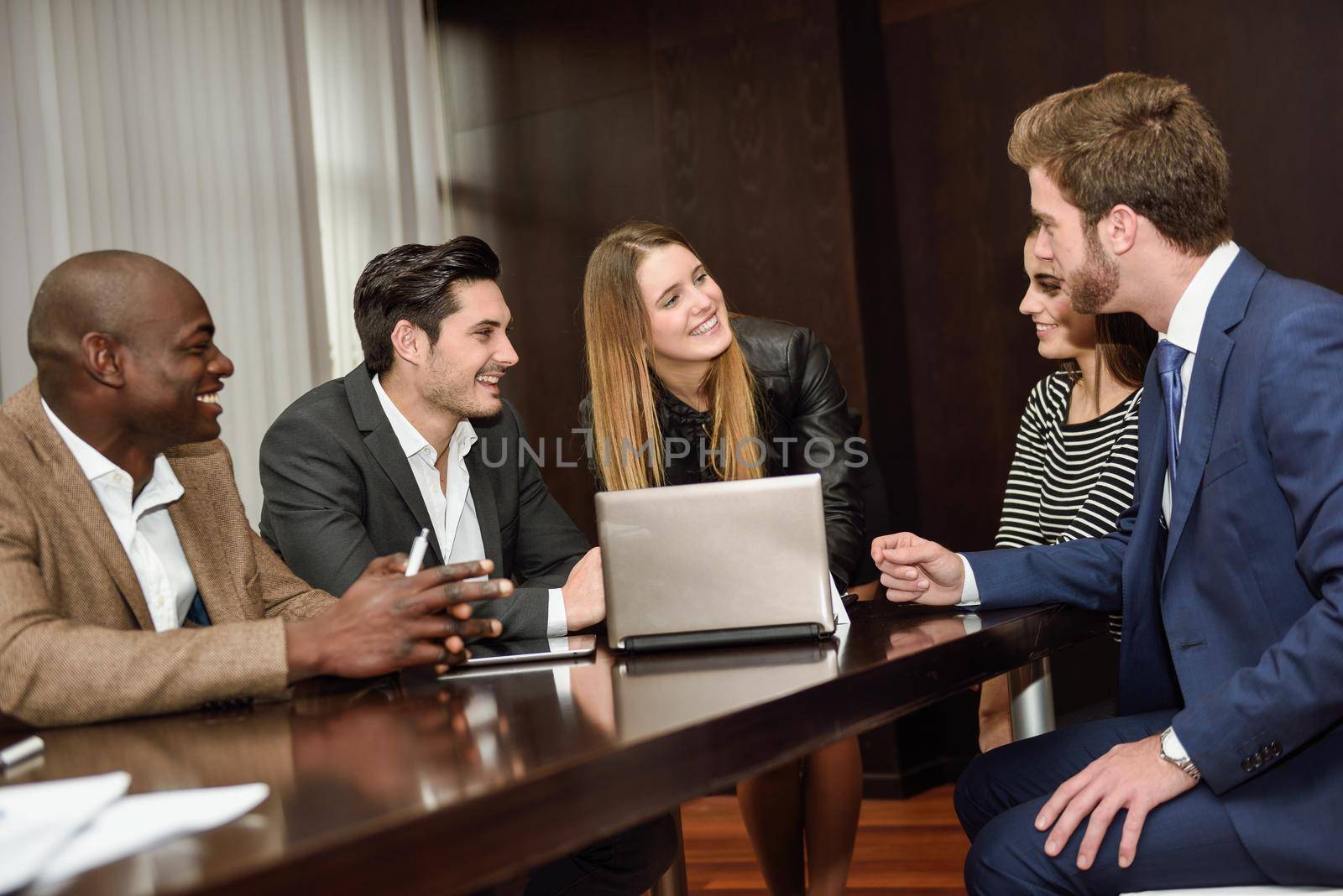 Businesspeople, teamwork. Group of multiethnic busy people working in an office