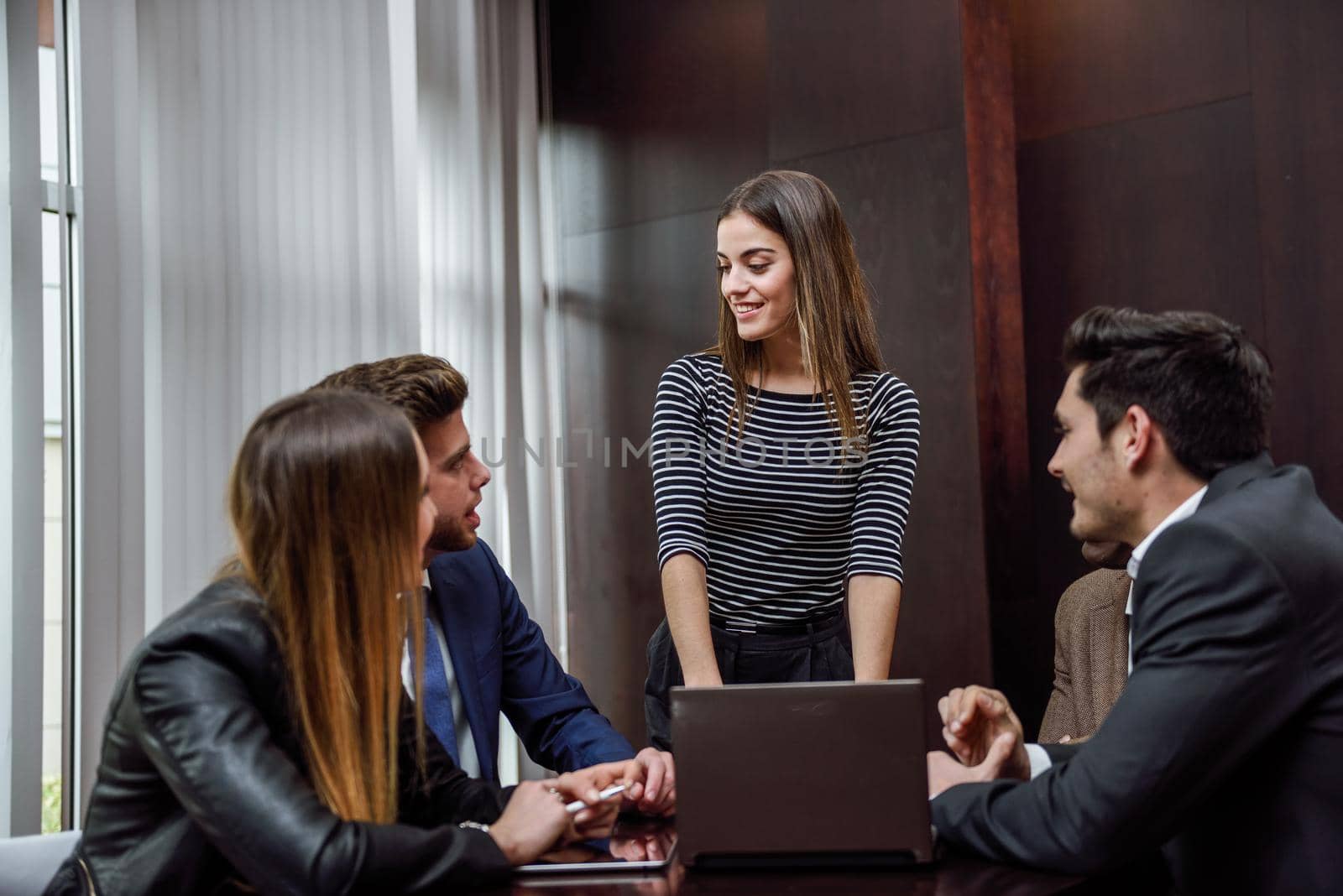 Businesspeople, teamwork. Group of multiethnic busy people working in an office