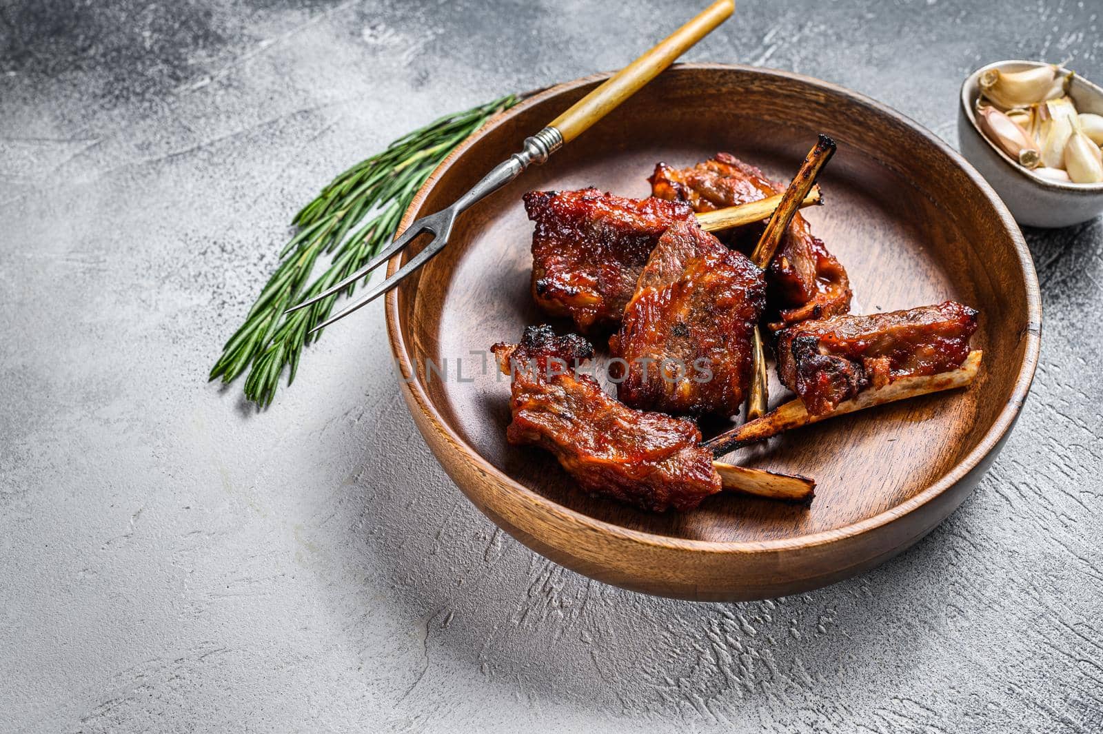 BBQ grilled sliced lamb short spare loin ribs. White background. Top view. Copy space by Composter