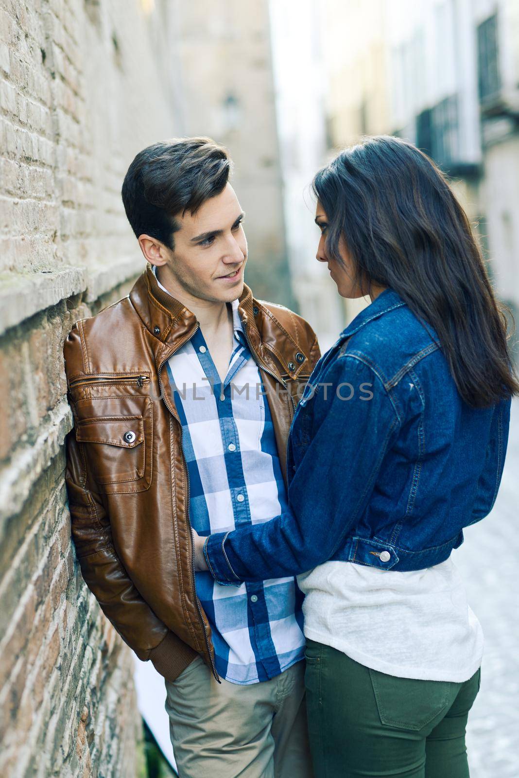 Portrait of a cheerful young couple on a city street