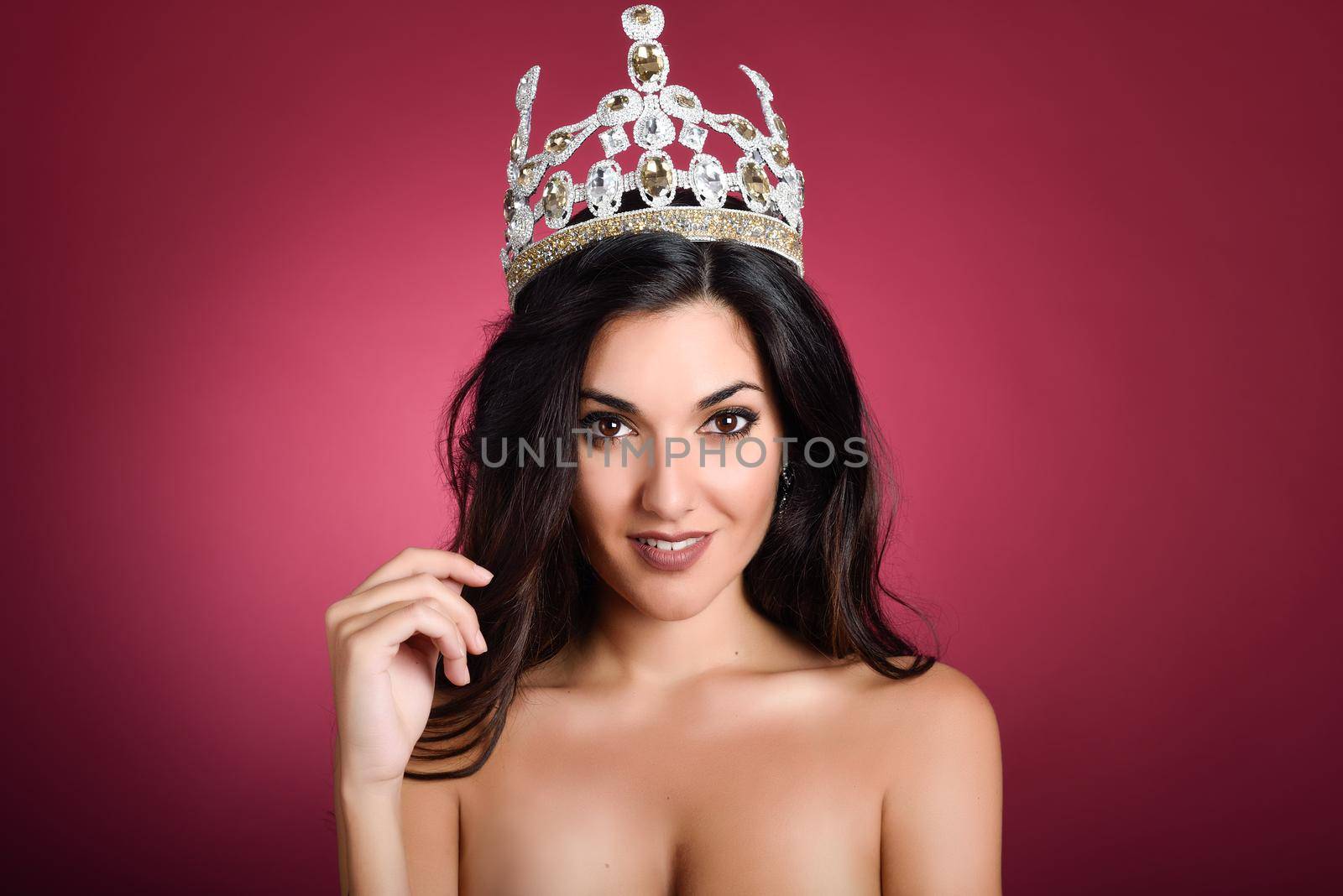 Crowned woman like miss of beauty looking at camera by javiindy