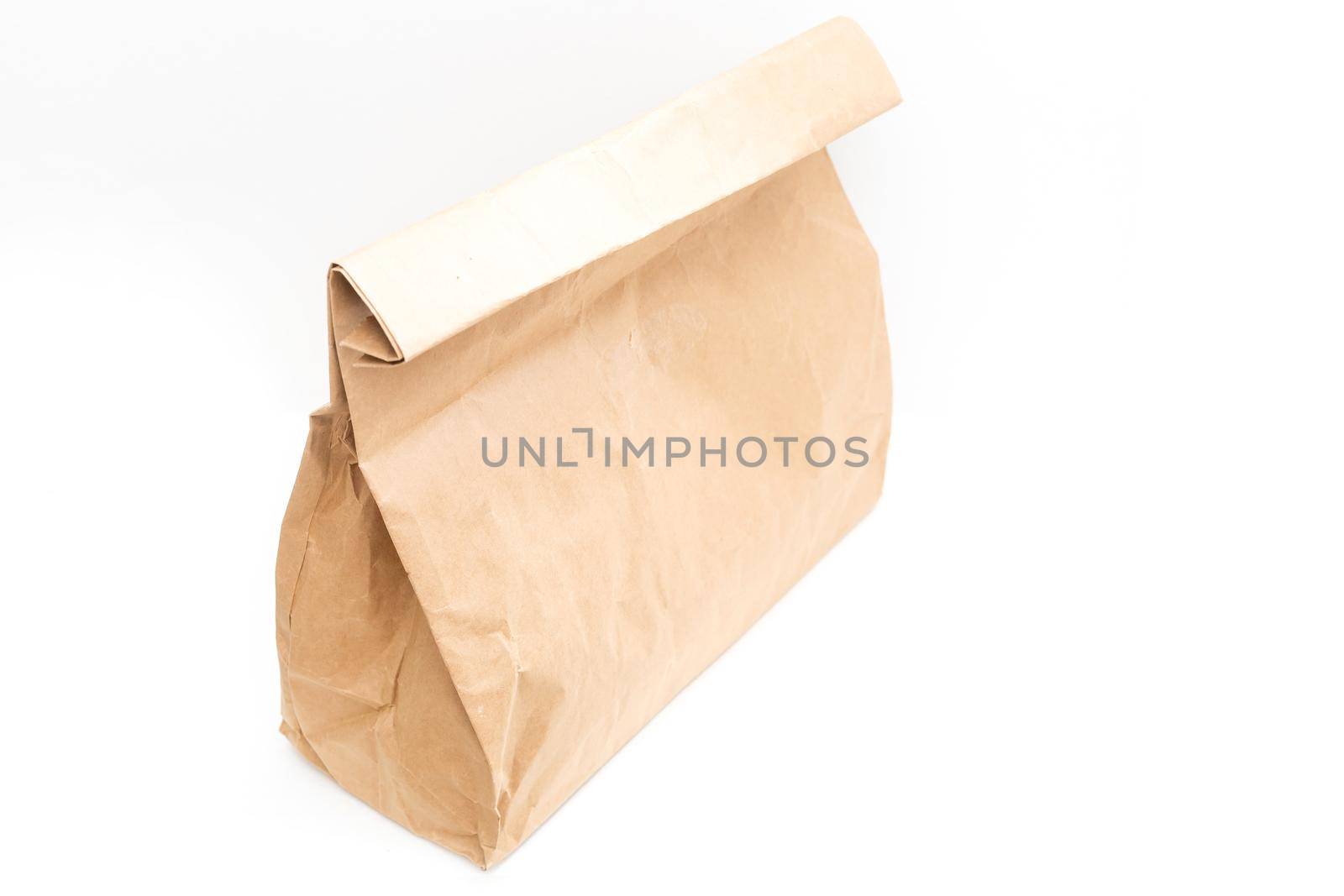 brown clear empty blank craft paper bag for takeaway isolated on white background. Packaging template mock up. Delivery service concept. Copy space. by Andelov13