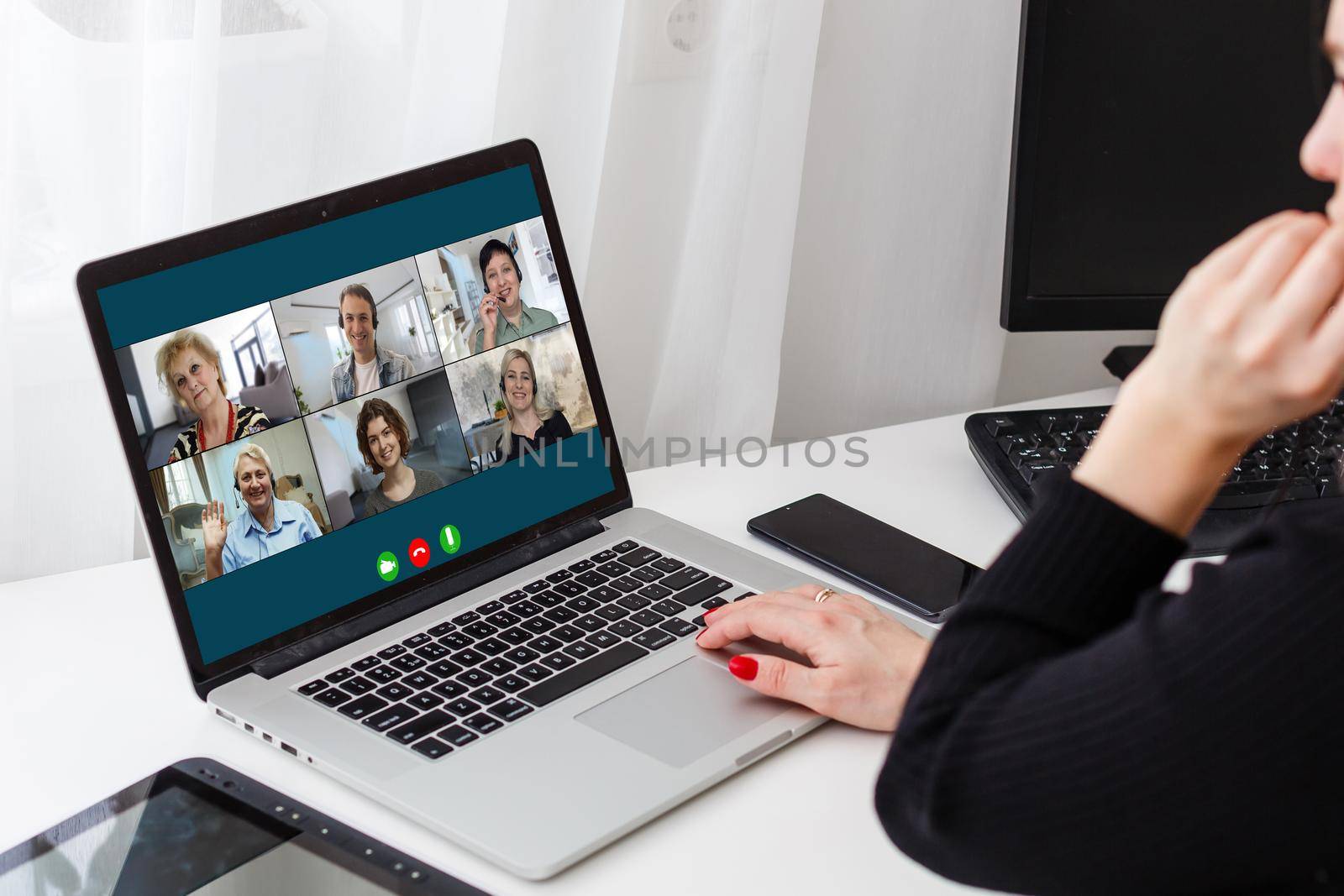 Virtual meeting online. Video conference by laptop. Online business meeting. On the laptop screen, people who gathered in a video conference to work on-line by Andelov13
