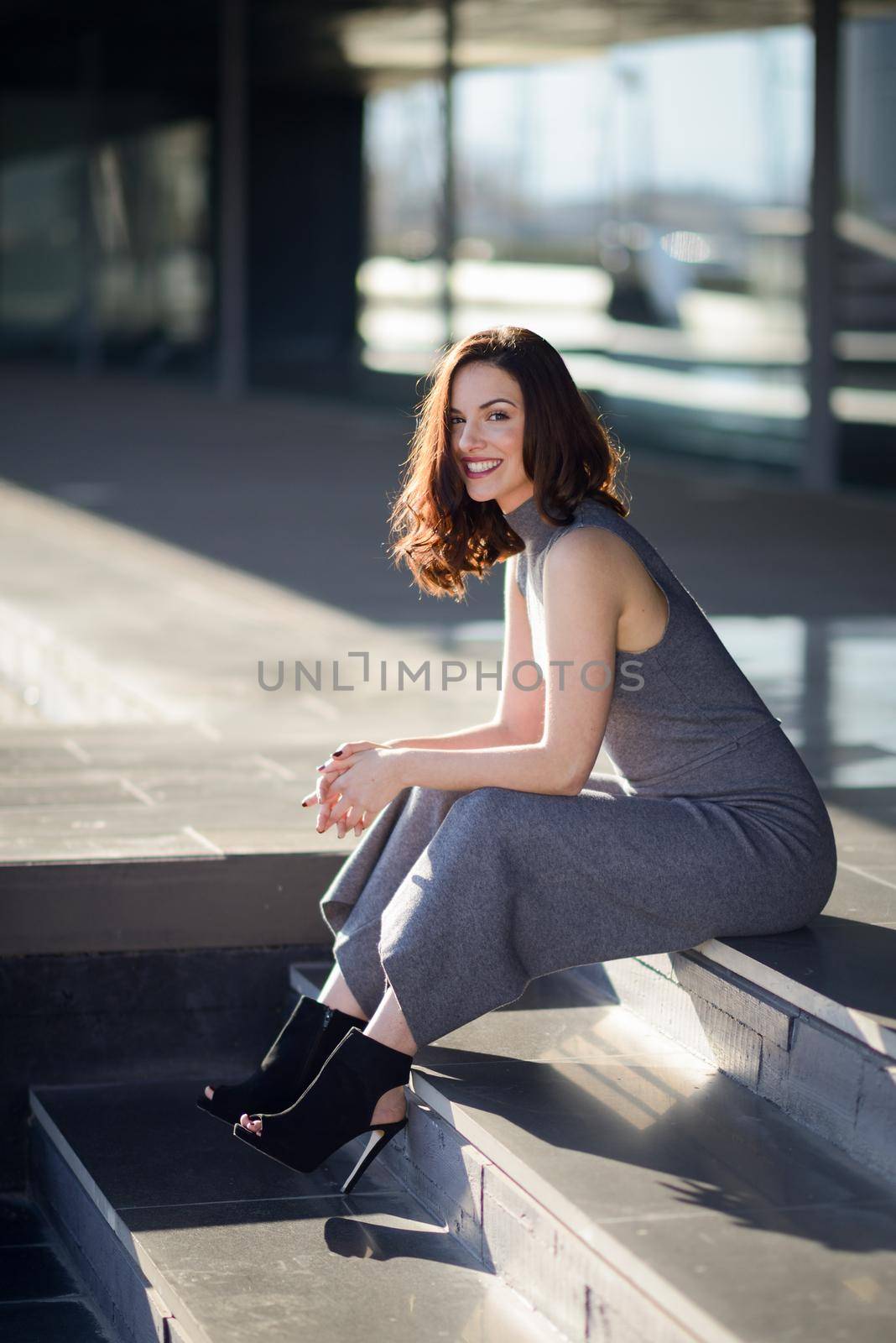 Young woman wearing casual clothes in urban background by javiindy