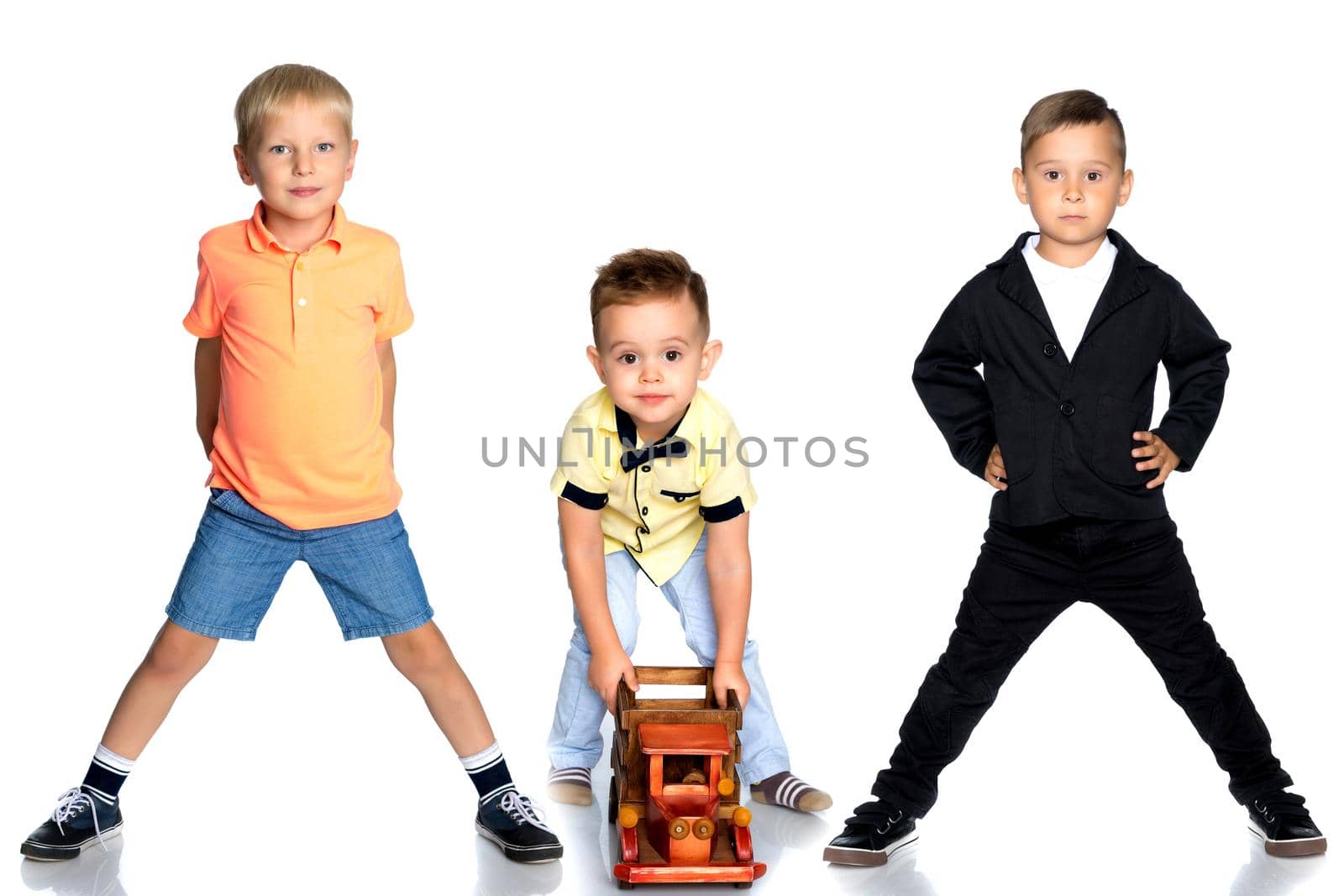 Group of smiling little boys. The concept of childhood, happiness, freedom. Isolated on white background.