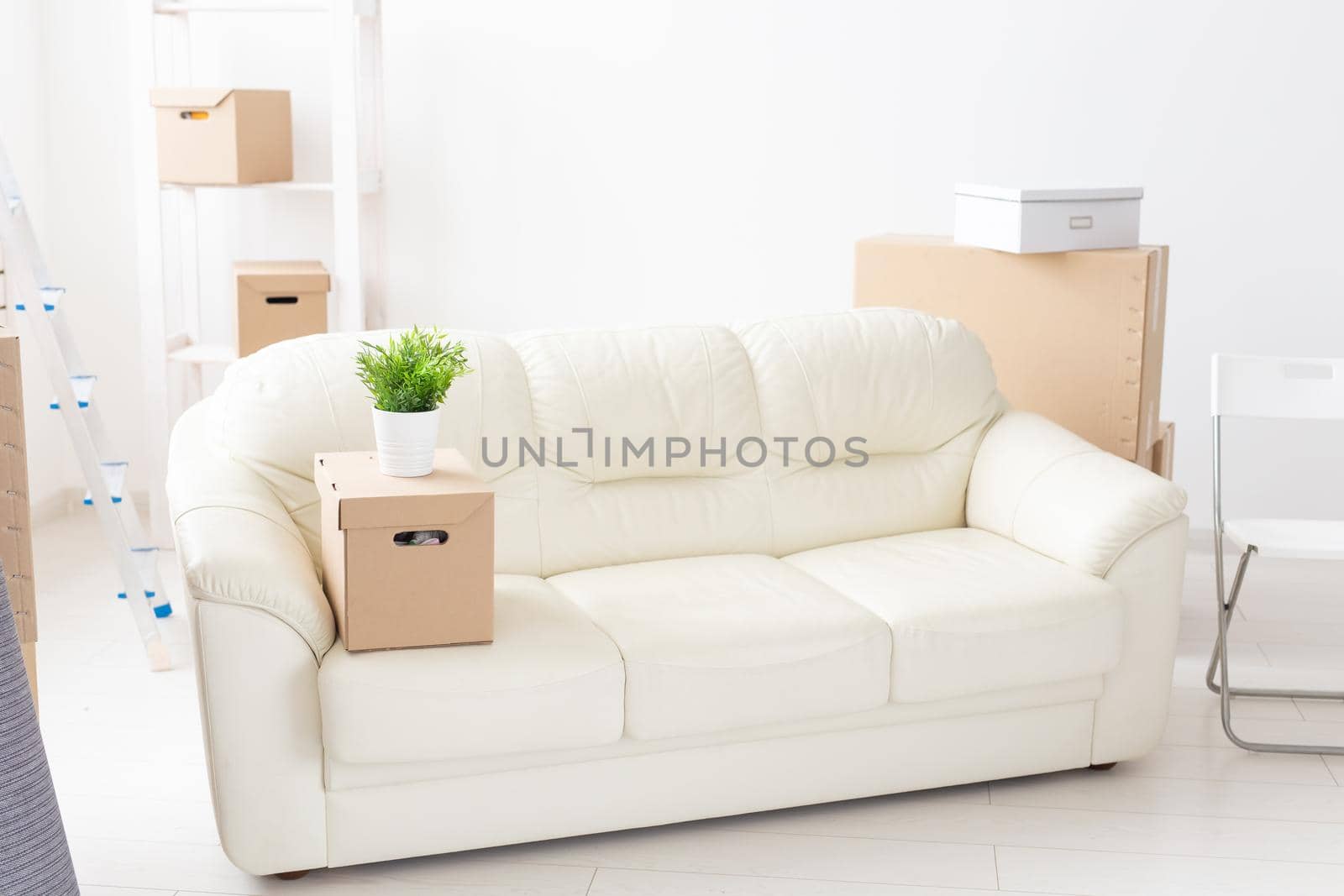 Cardboard boxes, sofa and carpet - moving to a new house by Satura86