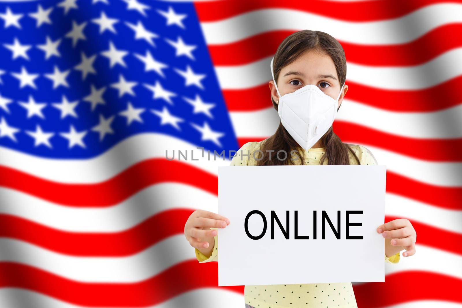 Little child with american flag and face mask